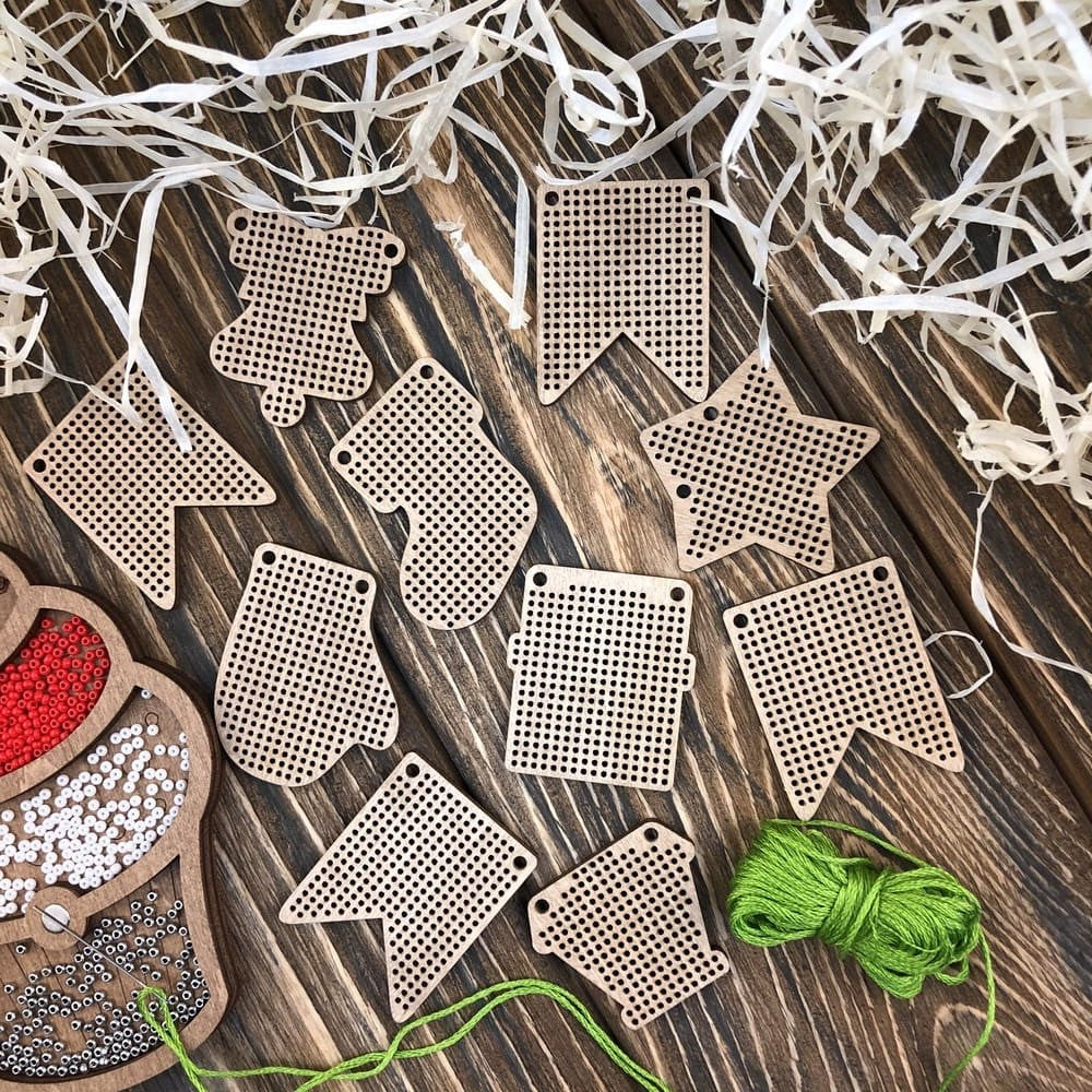 Set of 20 wooden embroidery blanks with intricate designs, perfect for creative needlework projects.