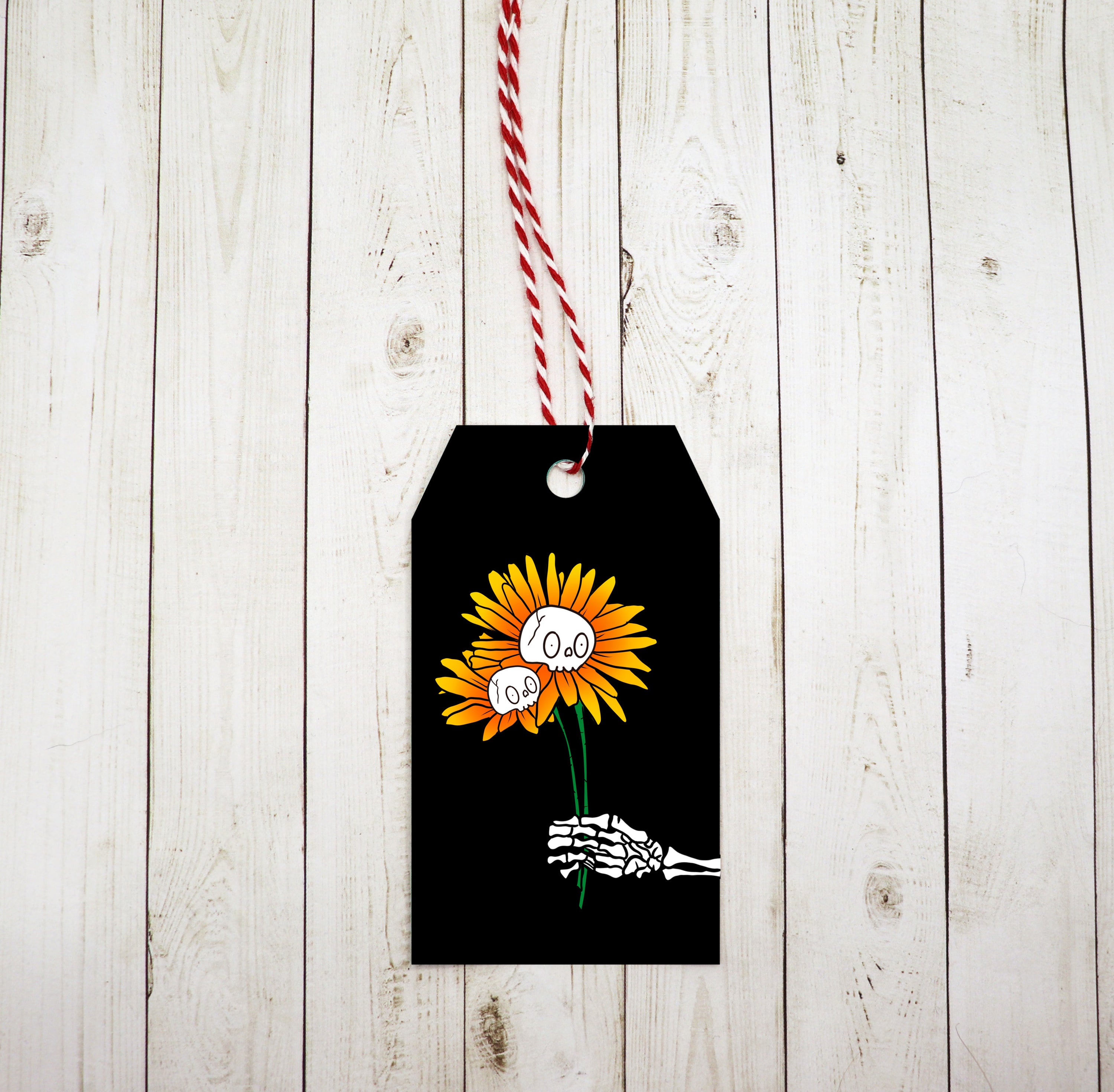 A set of Skeleton Sunflower Gift Tags featuring a whimsical design, red and white twine, printed on heavy white cardstock.