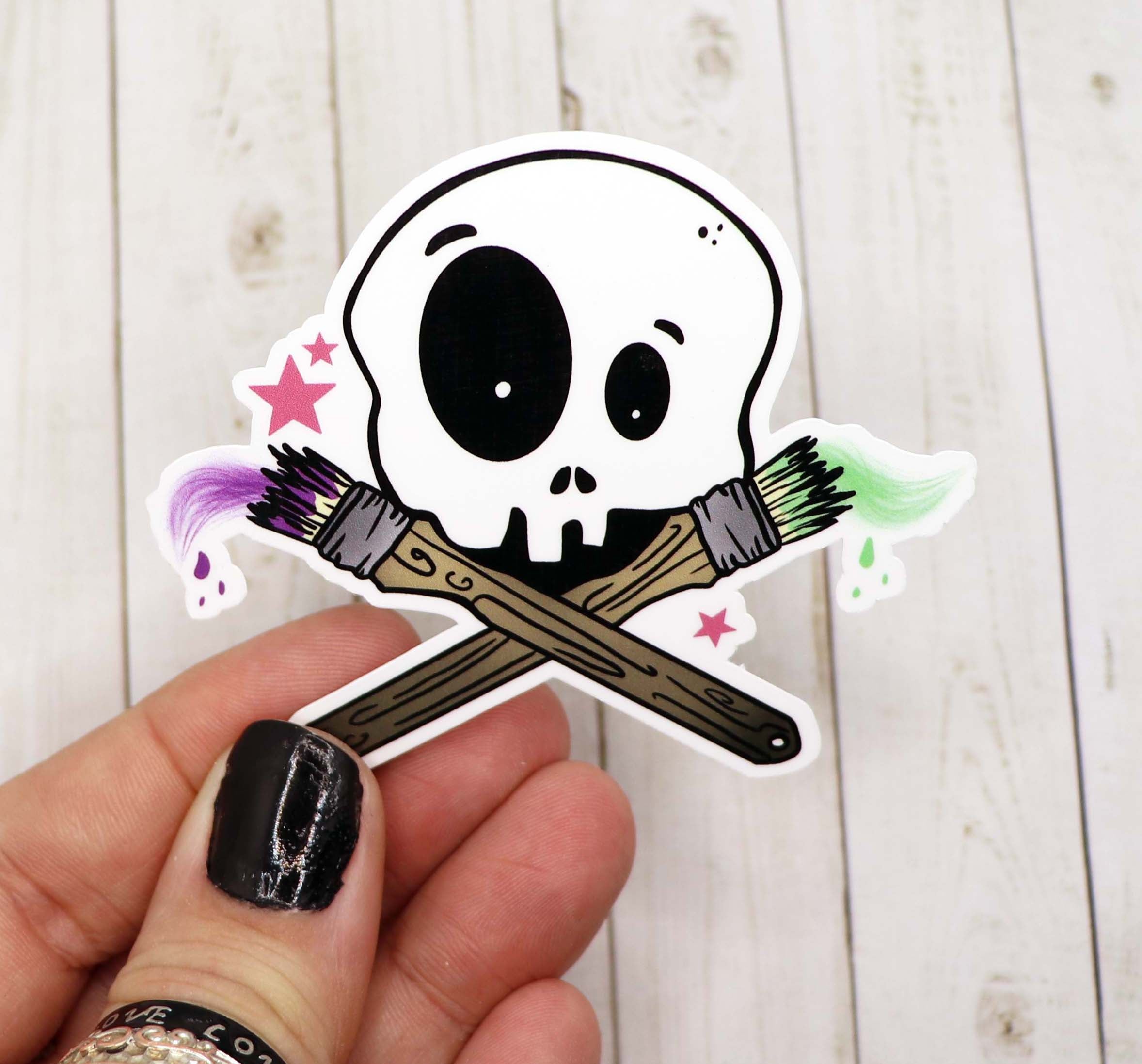 A vibrant Skull Artist Sticker on a matte vinyl surface, showcasing intricate skull design.