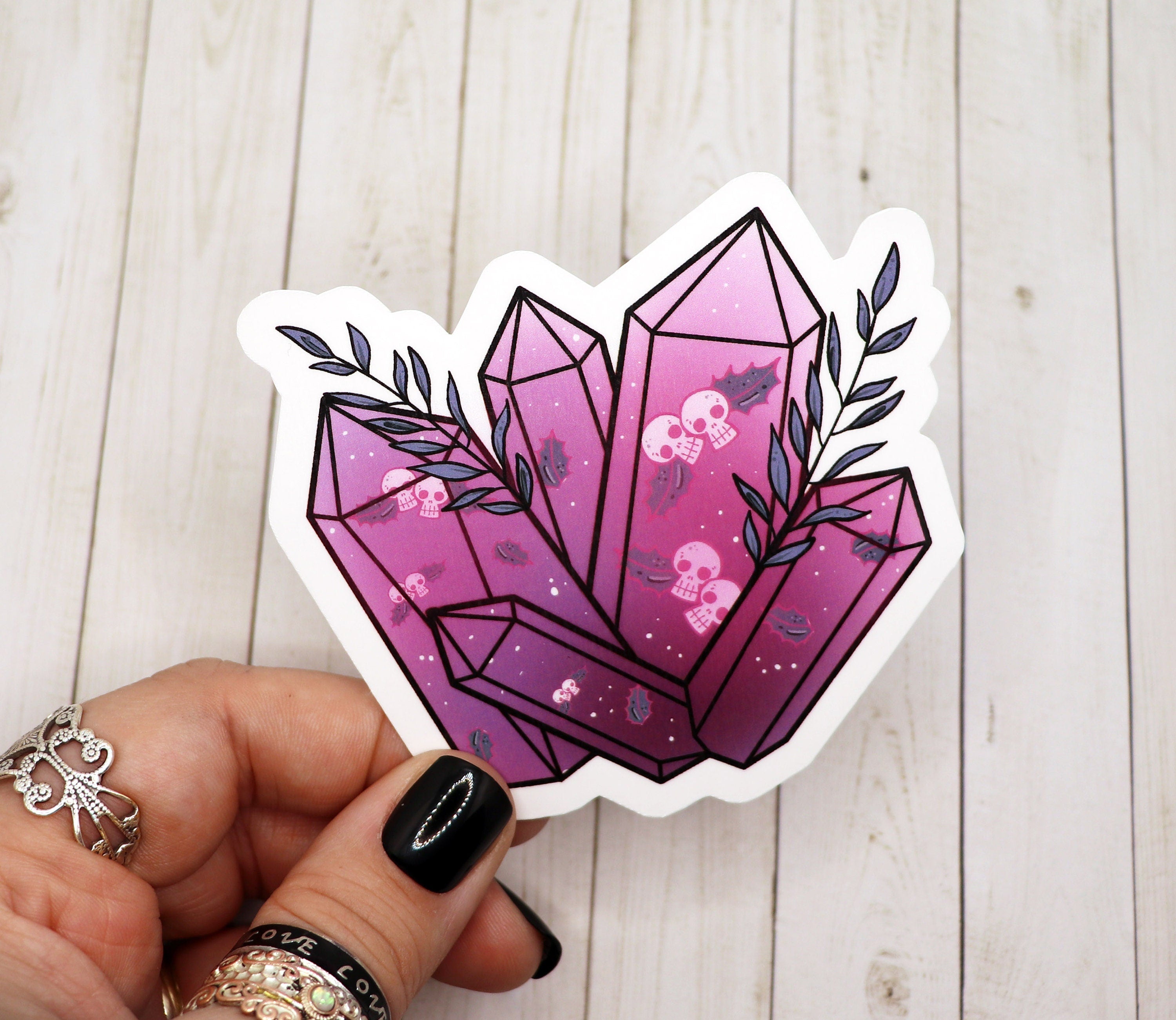 A vibrant Skull Mistletoe Crystal Sticker featuring a unique skull design with mistletoe accents, printed on high-quality matte vinyl.