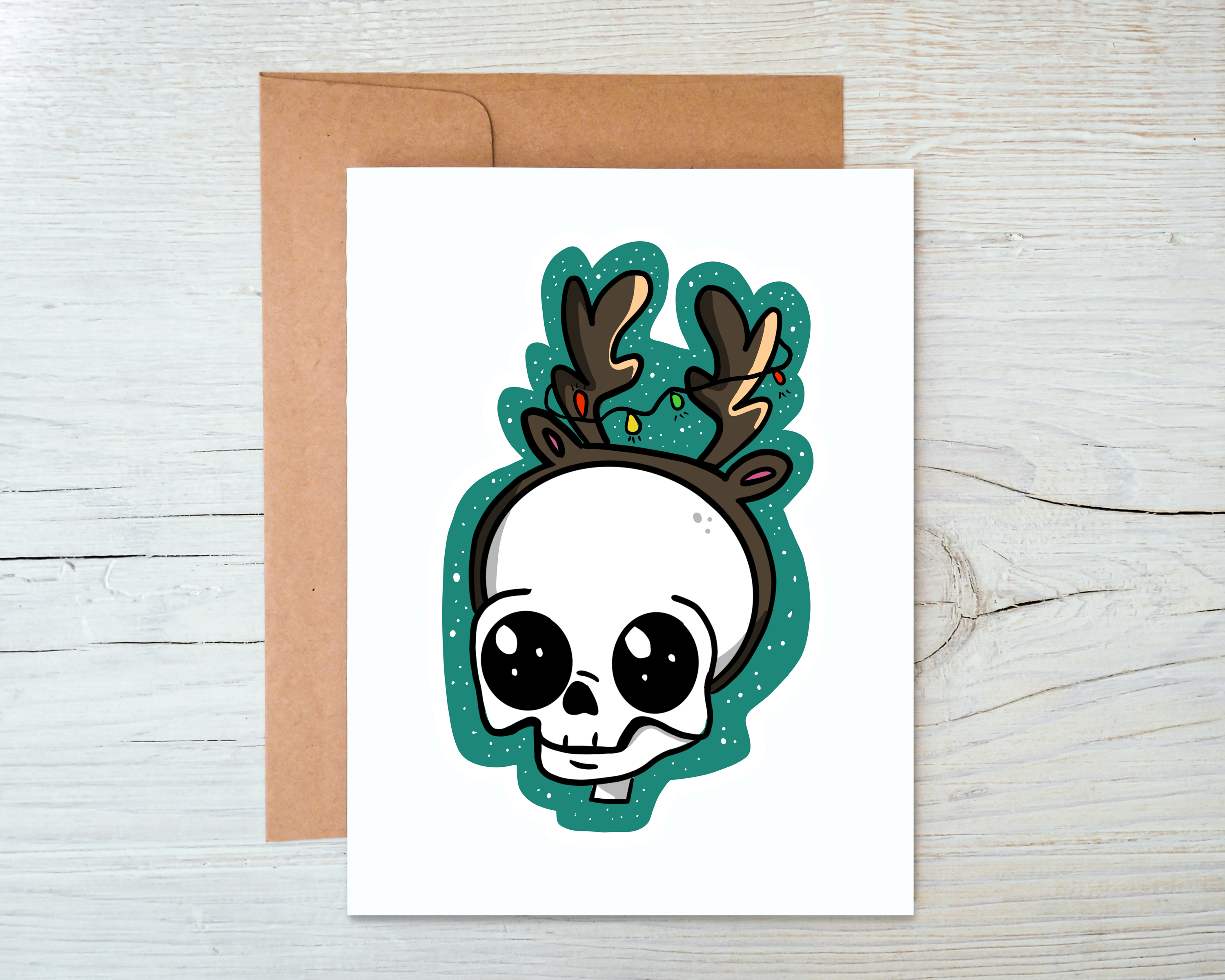 A Skull Reindeer Card featuring a unique design, blank inside, accompanied by a kraft envelope, perfect for personalized messages.
