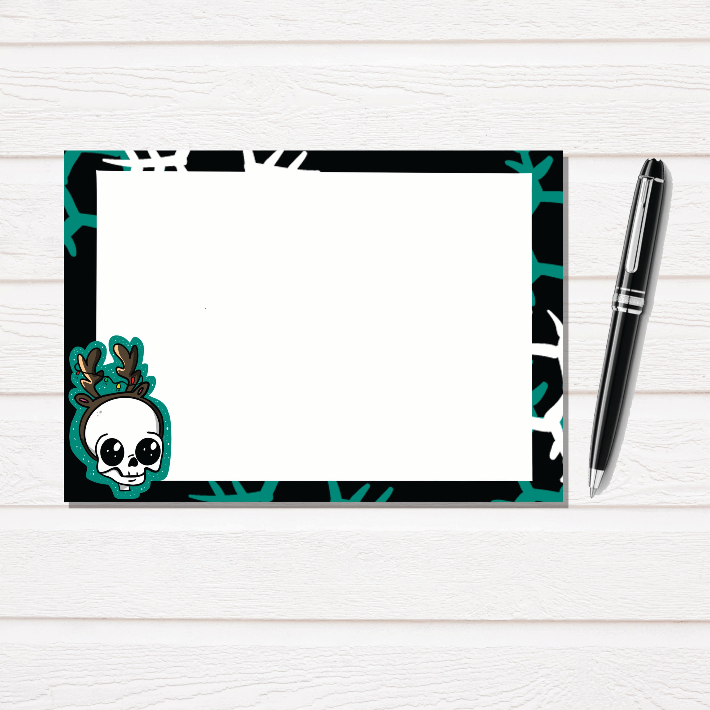 Skull Reindeer Notecard Stationary Set featuring hand-drawn illustrations, 12 notecards, and matching white linen envelopes in a clear box.