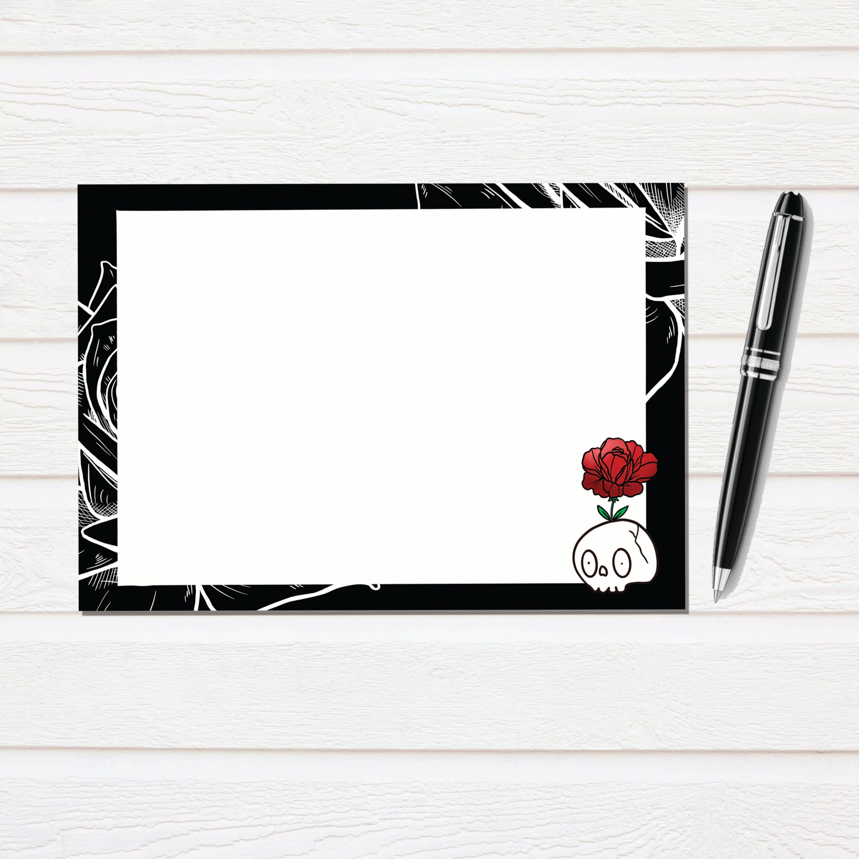Skull Rose Notecard Stationary Set featuring hand-drawn illustrations, 12 notecards, and matching envelopes in a clear box.
