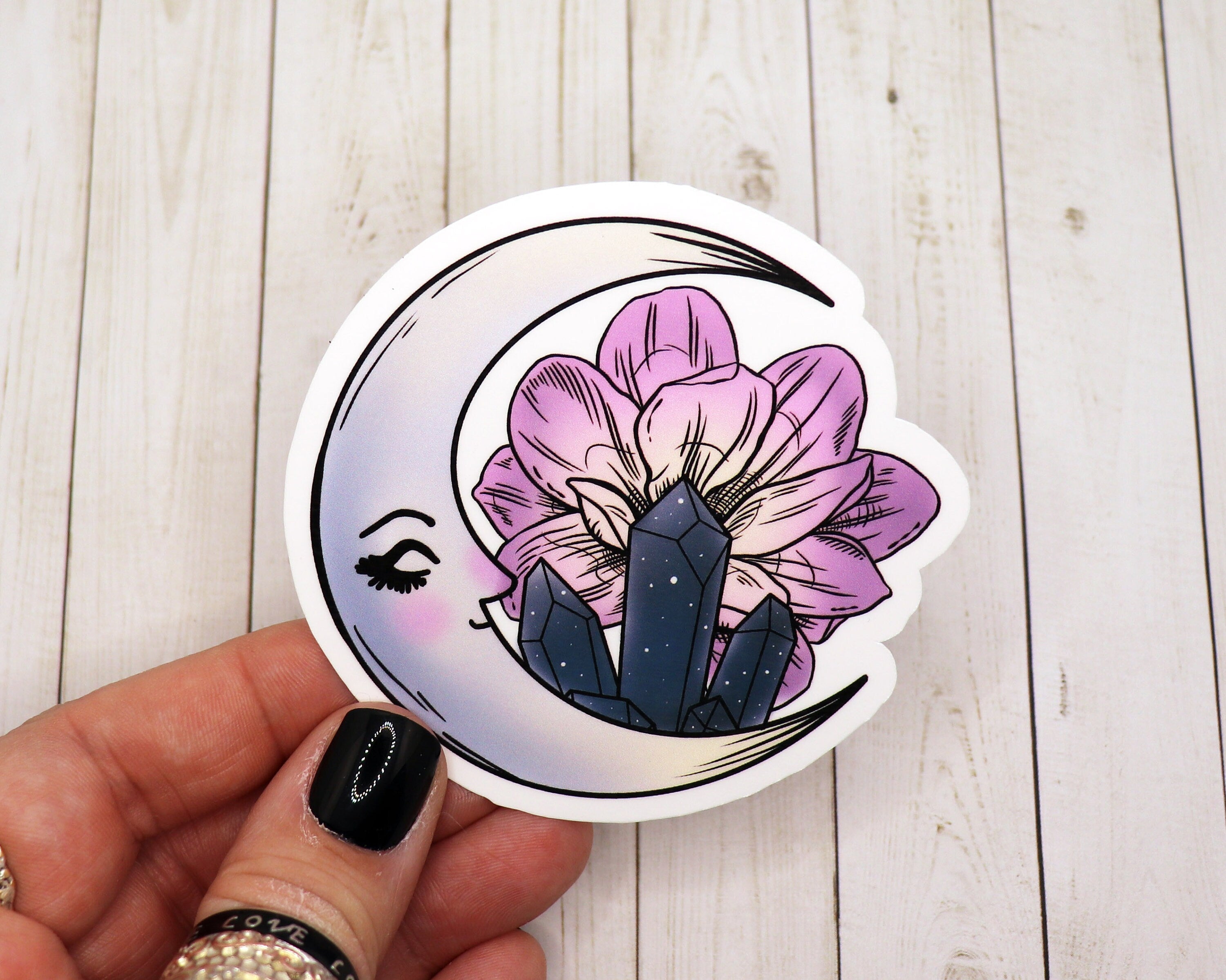 A whimsical Sleeping Moon Sticker featuring a serene moon design, perfect for personalizing various items.