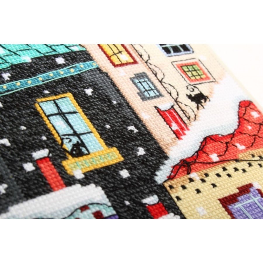 Snow Falling M654 Counted Cross Stitch Kit with Aida fabric, DMC threads, and instructions for creating a winter scene.