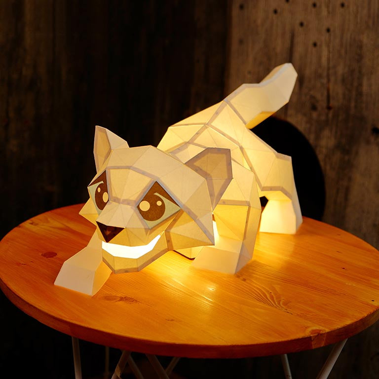 A beautifully crafted Snow Leopard Model lamp made from pre-cut paper, showcasing intricate details and a unique design.