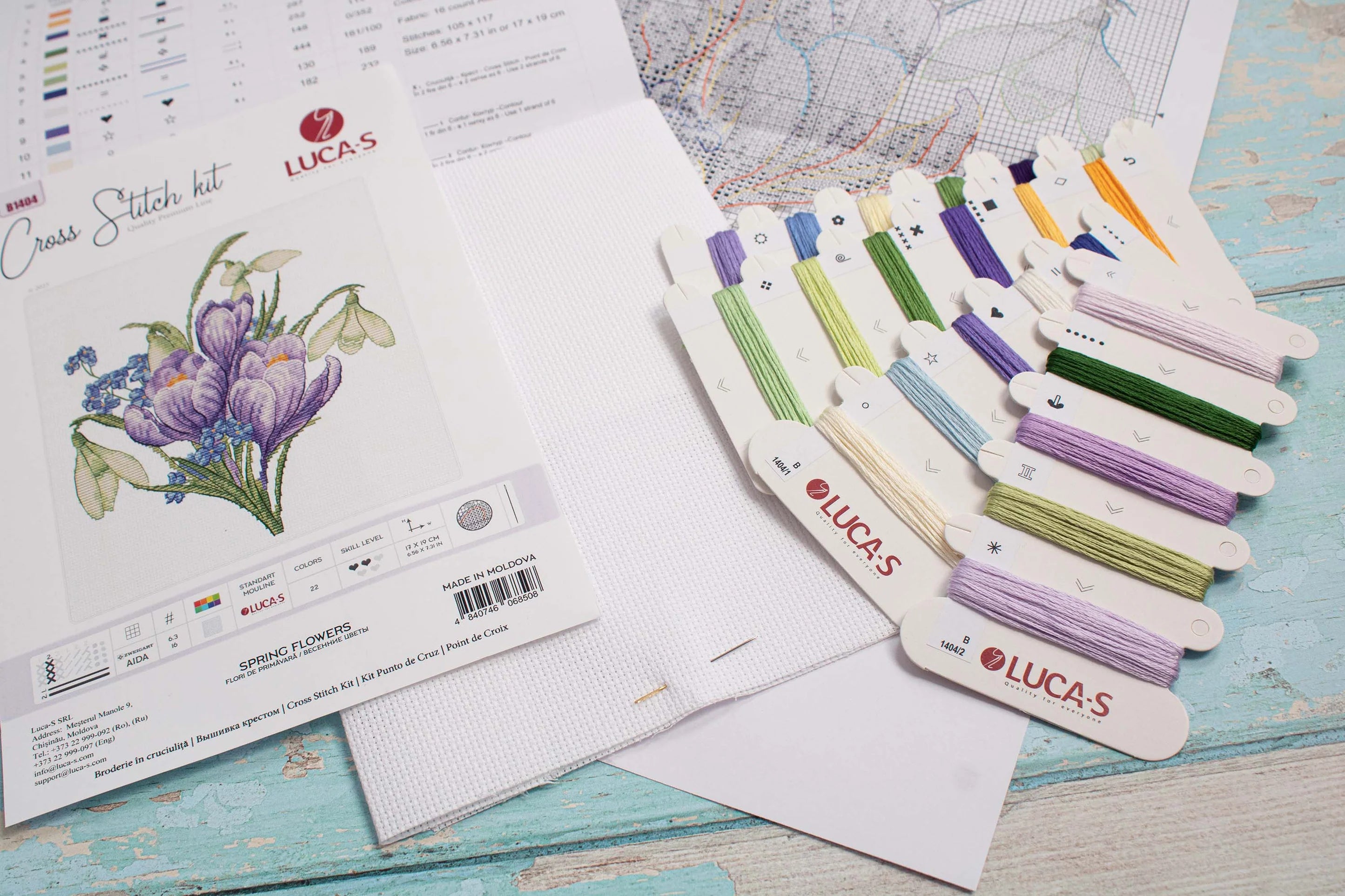 Spring Flowers B1404L Counted Cross-Stitch Kit featuring vibrant threads and canvas, ideal for crafting enthusiasts.