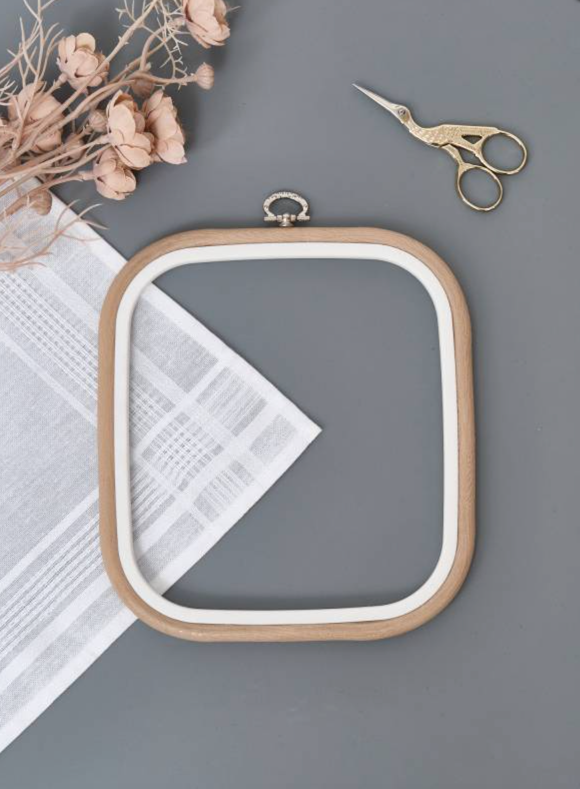Nurge 230-12 Flexi Hoop in sand color, showcasing its square design and rubberized wood-grained finish, ideal for embroidery and needlework.