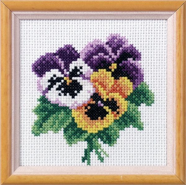 Stamped Cross Stitch Kit 'Pansies' featuring printed Aida fabric, colorful threads, and included needle and instructions.
