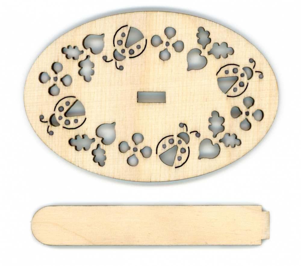 A cutout plywood display stand for cross-stitch projects, measuring 9*6 cm, showcasing intricate designs elegantly.