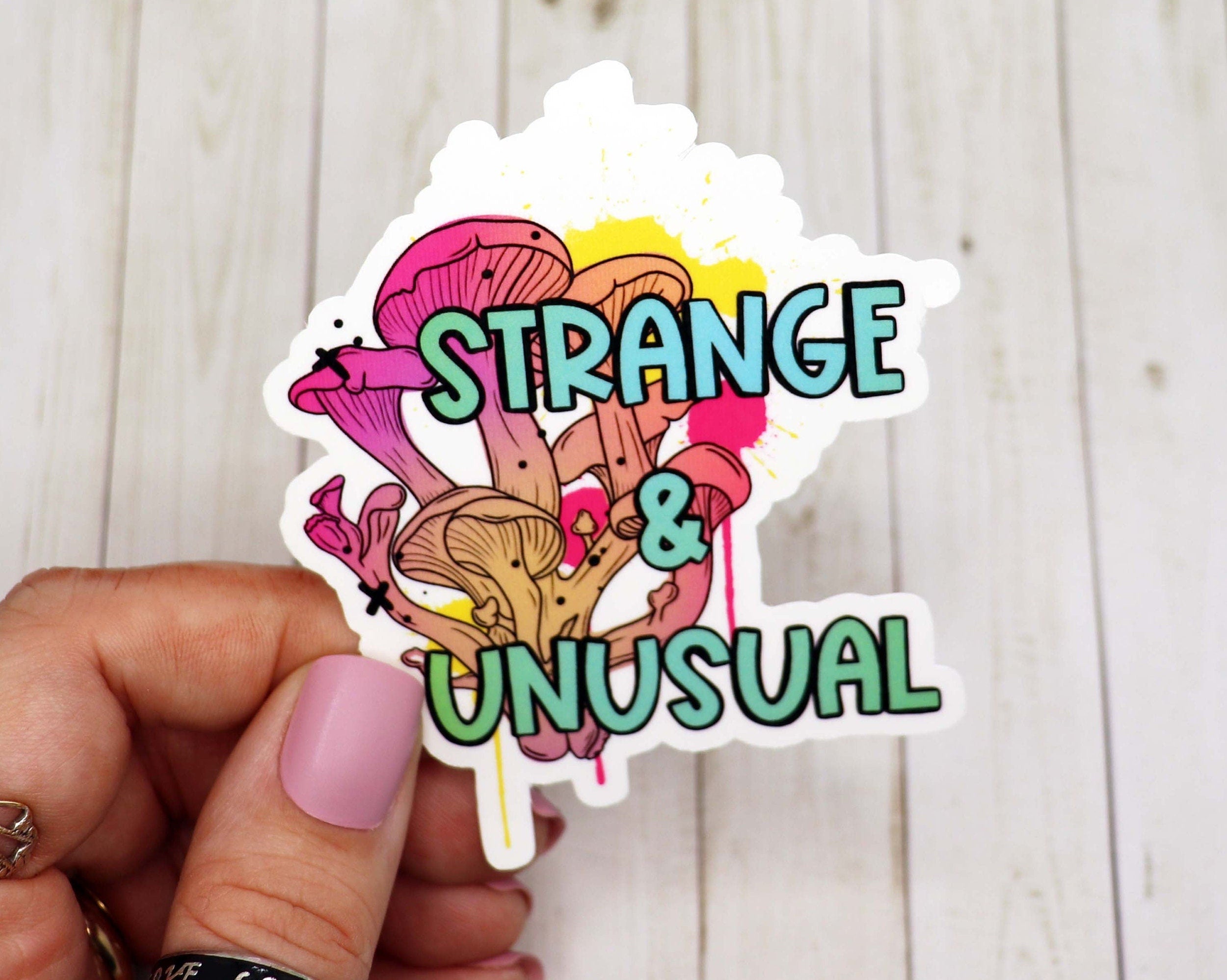 Strange and unusual vinyl sticker featuring a unique design, perfect for personalizing various items.
