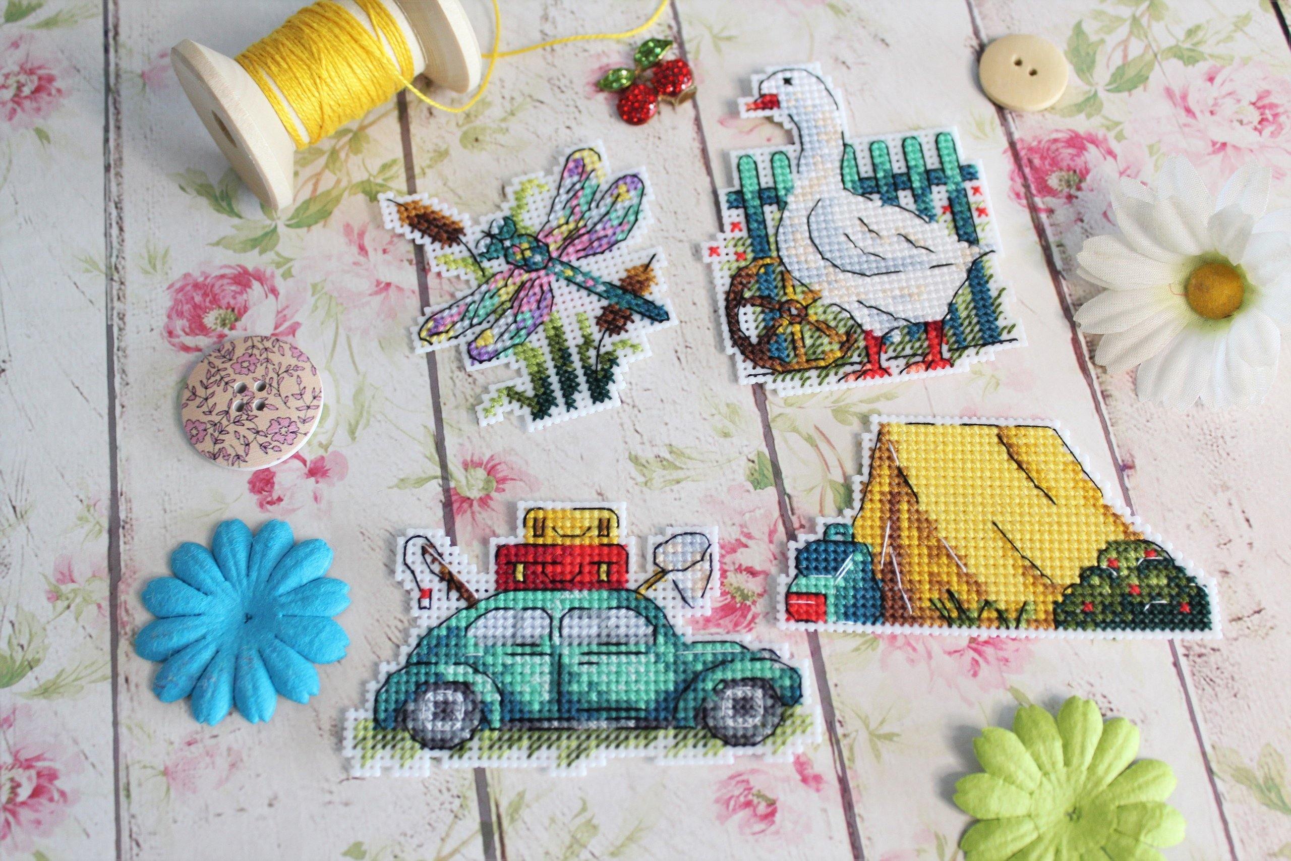 Summer Magnets SR-579 Plastic Canvas Counted Cross Stitch Kit with colorful threads, plastic canvas, and beads for DIY fridge magnets.