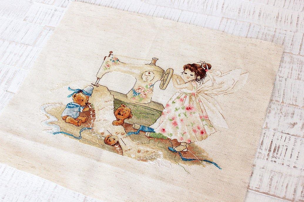 The Fairy-Needlewoman B1116L Counted Cross-Stitch Kit featuring Aida16 Rustic canvas, 38 Anchor colors, and a needle.