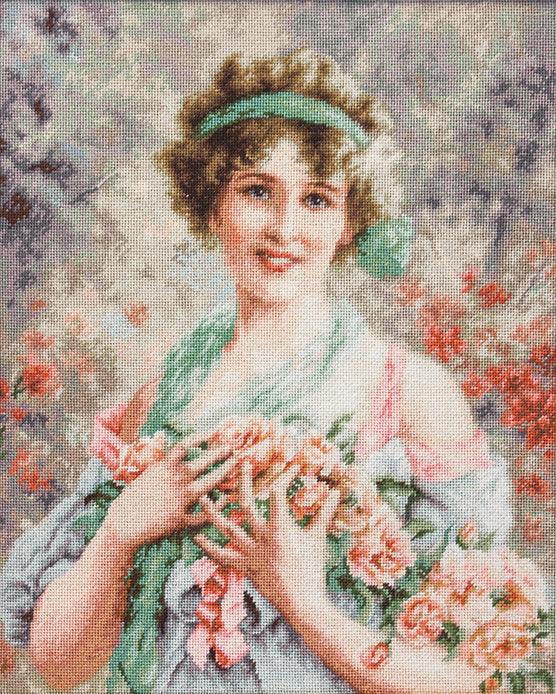 The Girl with Roses B553L Counted Cross-Stitch Kit featuring colorful threads, Aida canvas, and a needle.