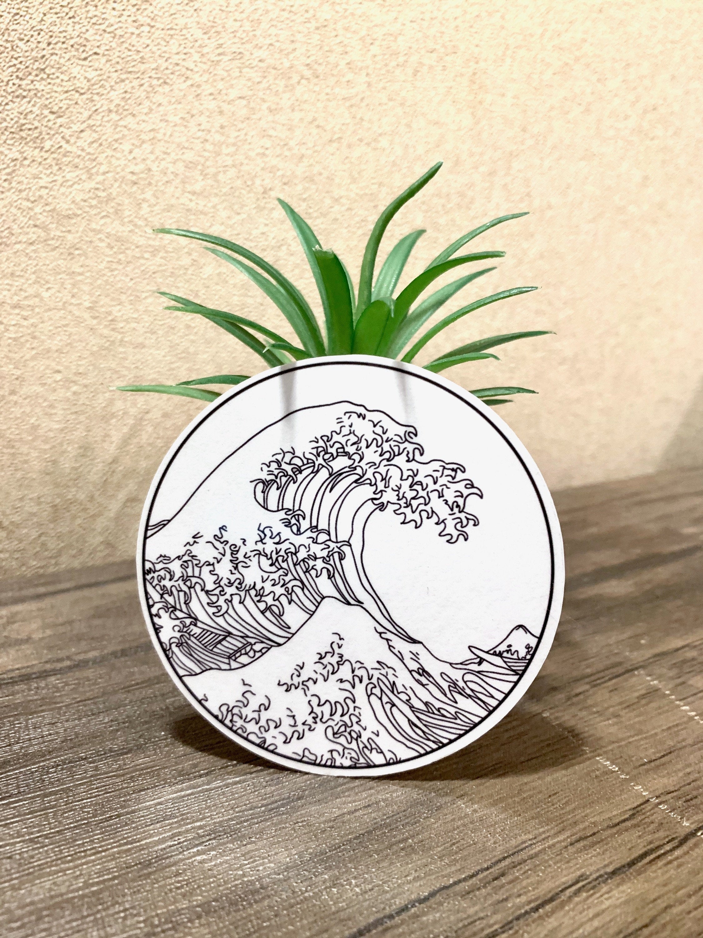 A vibrant sticker featuring The Great Wave off Kanagawa artwork, perfect for personalizing items.