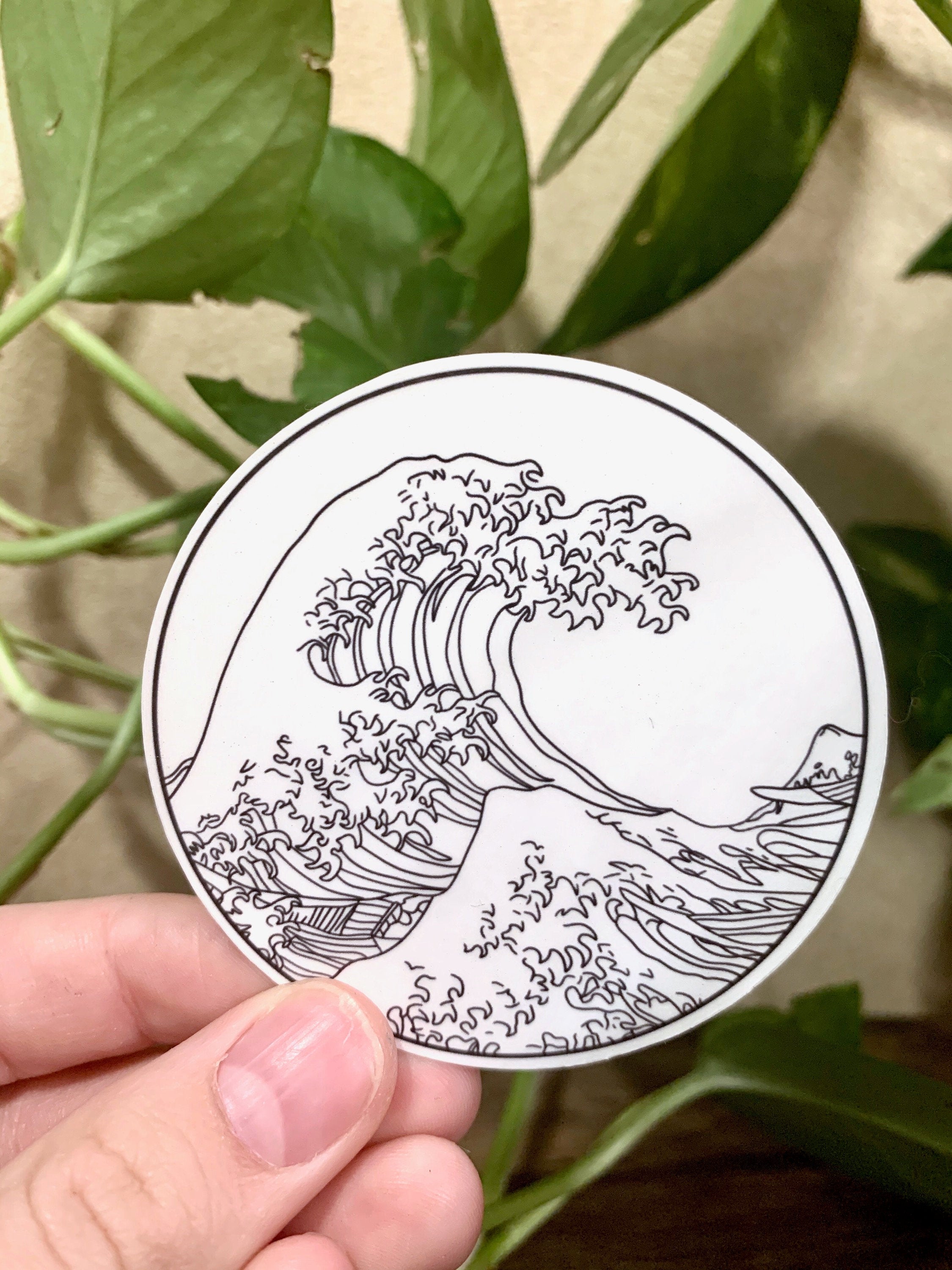 A vibrant sticker featuring The Great Wave off Kanagawa artwork, perfect for personalizing items.