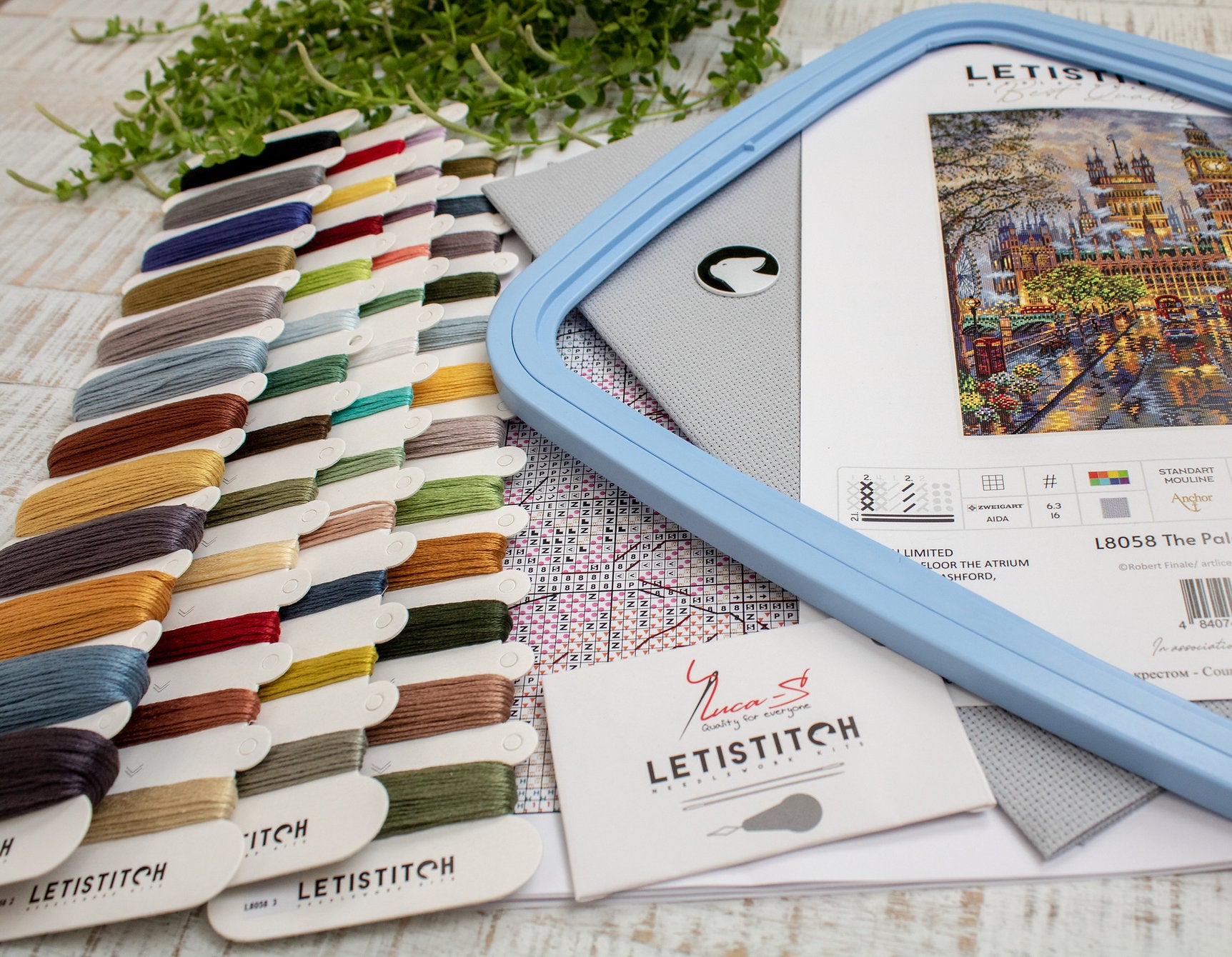 The Palace L8058 Counted Cross Stitch Kit featuring vibrant Anchor threads, Zw.Aida canvas, and included needle and instructions.