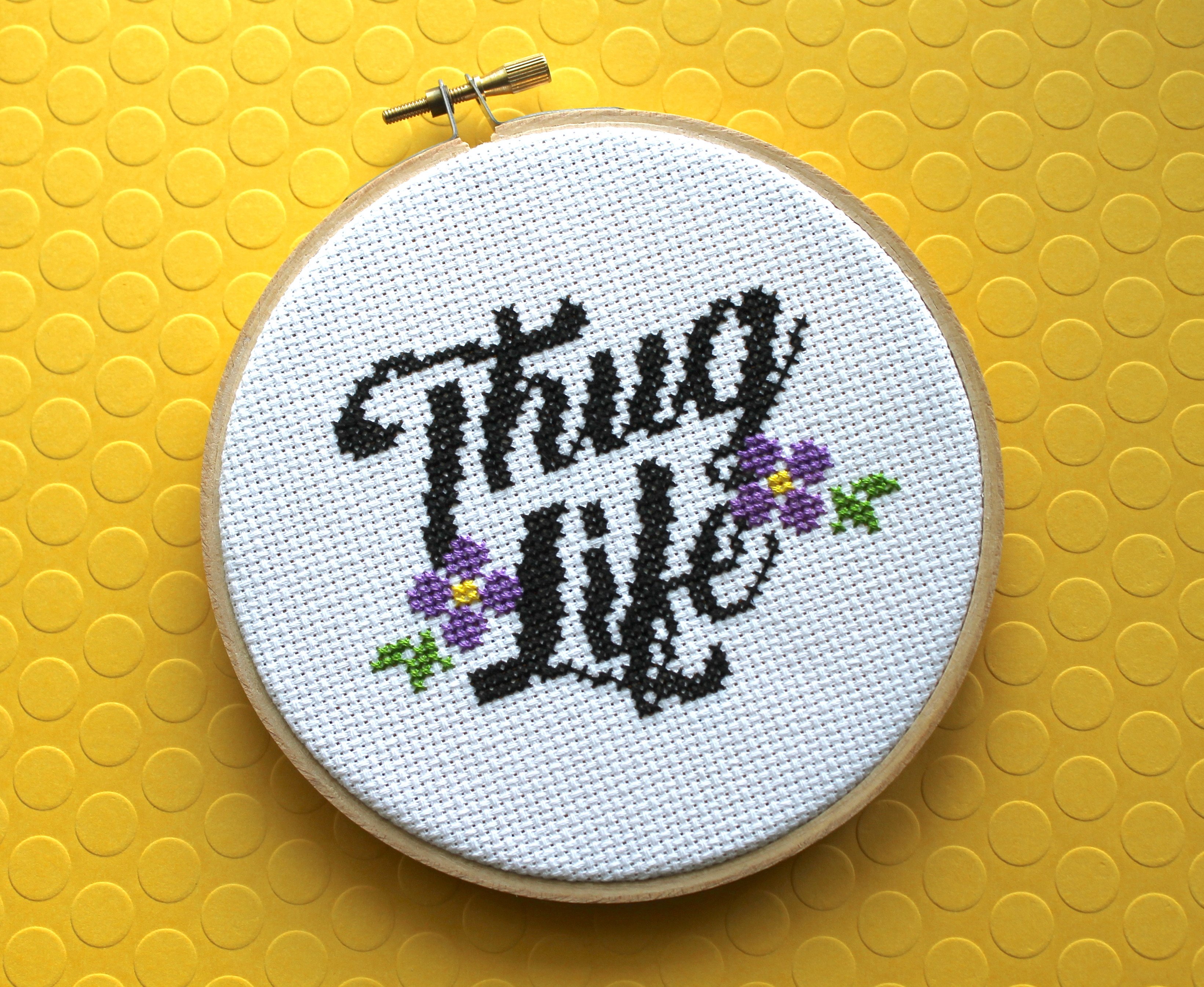 Thug Life Counted Cross Stitch DIY Kit featuring floral elements and cursive lettering.