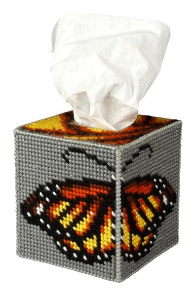A beautifully crafted needlepoint tissue box cover featuring a colorful butterfly design, made from plastic canvas and acrylic yarn.