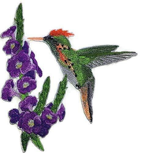 Embroidered patch featuring a Tufted Coquette Hummingbird and Porterweed flower, showcasing vibrant colors and intricate stitching.
