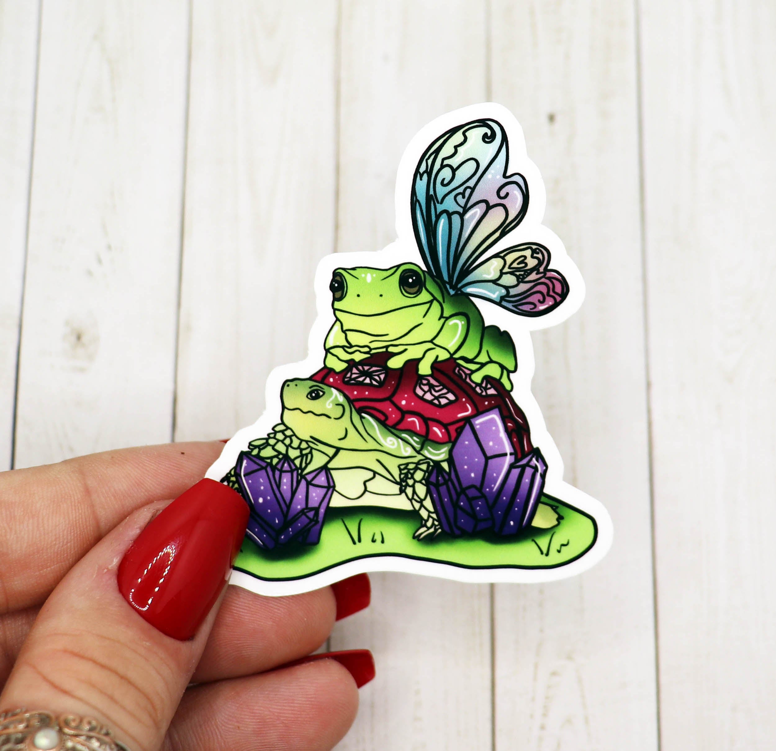 A colorful Turtle and Frog Vinyl Sticker featuring a whimsical design, perfect for personalizing various items.