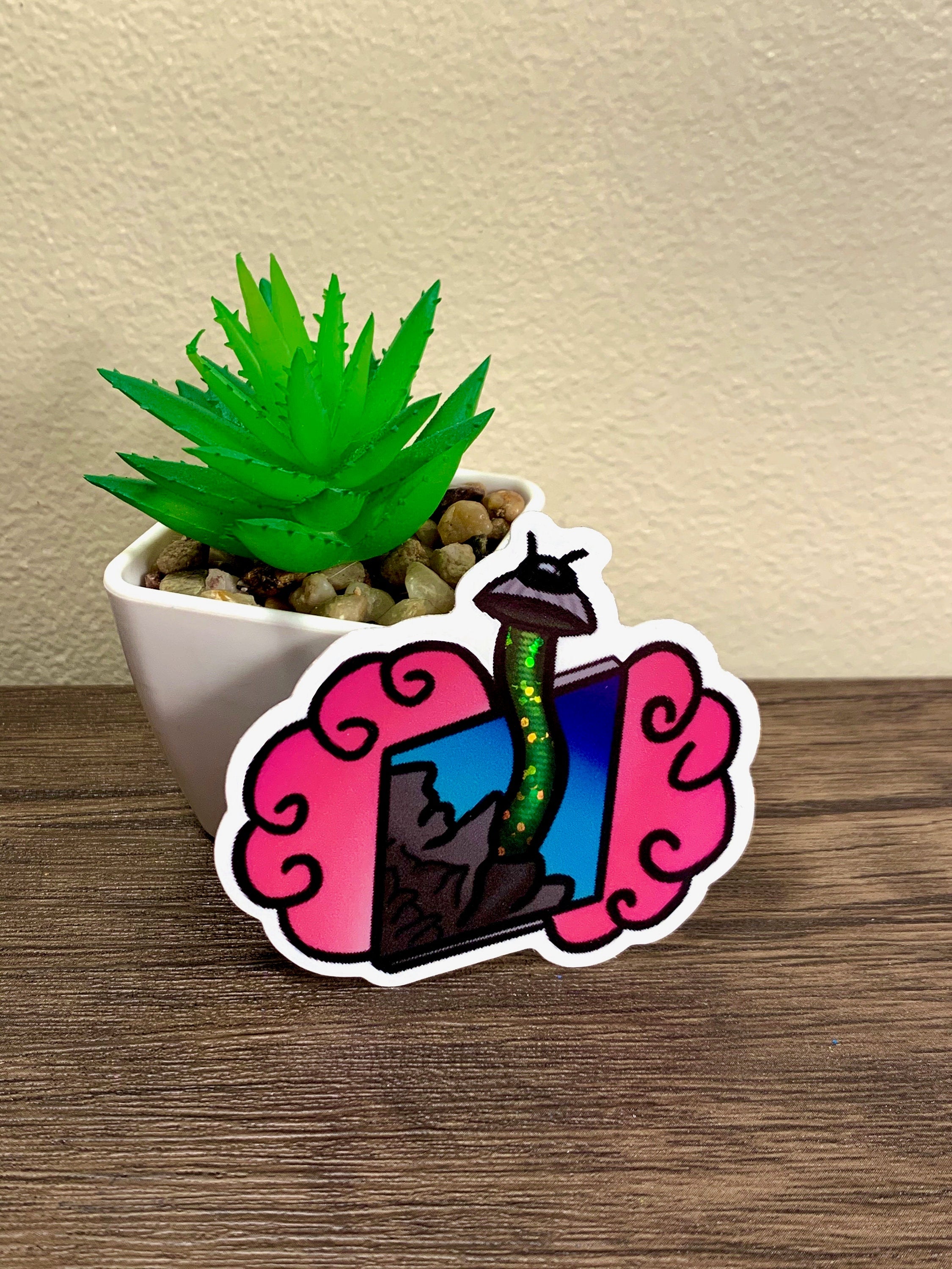 A colorful UFO glitter holographic sticker featuring a whimsical design, perfect for personalizing items like laptops and water bottles.