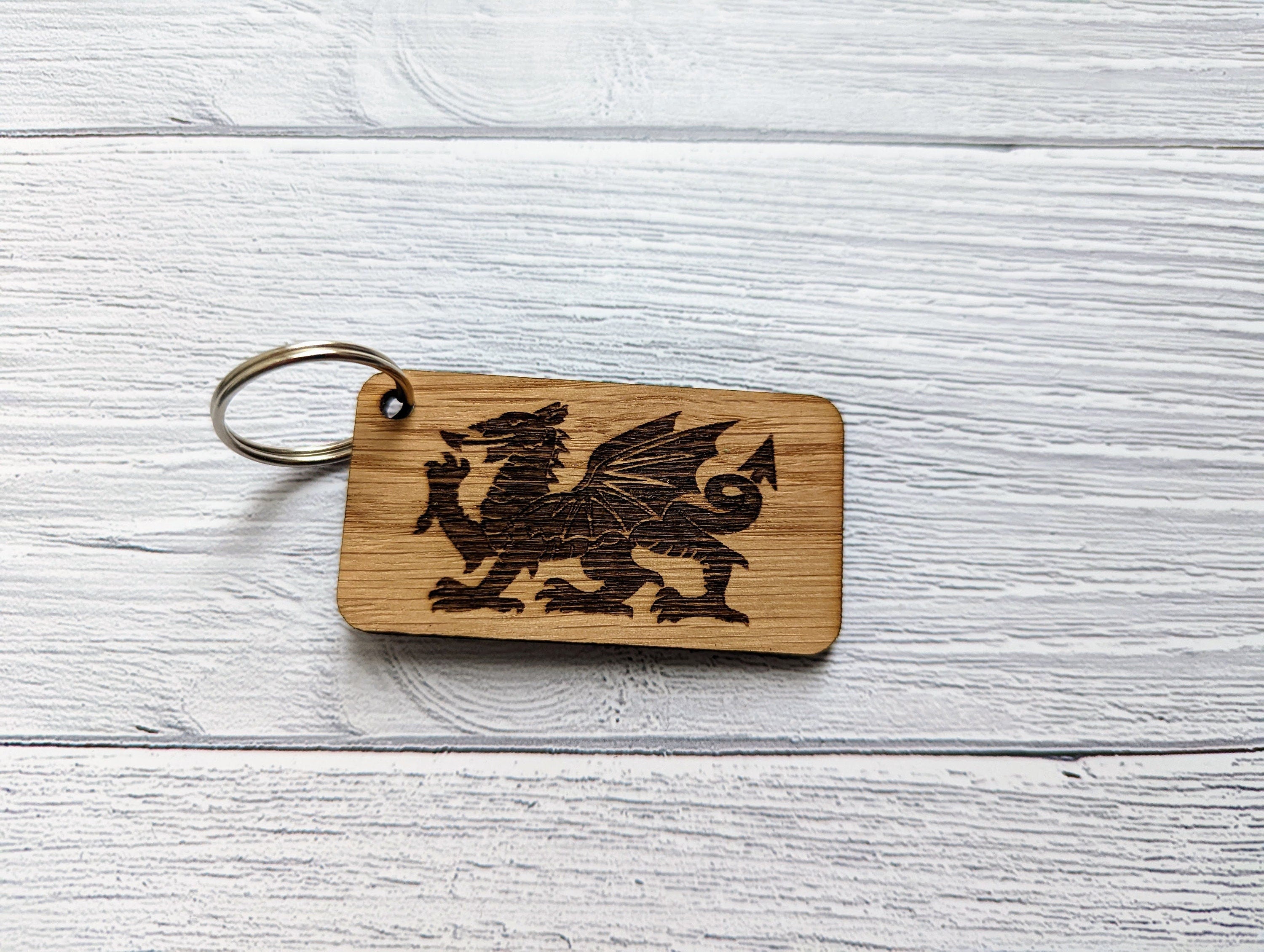 Handcrafted Wales Keyring made from oak MDF featuring an engraved Welsh Dragon design, perfect for gifts.