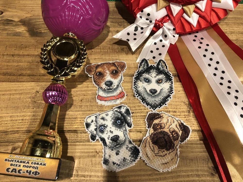 Who Said Woof? Magnets SR-409 Cross Stitch Kit featuring colorful threads, plastic canvas, and finished dog-themed magnets.