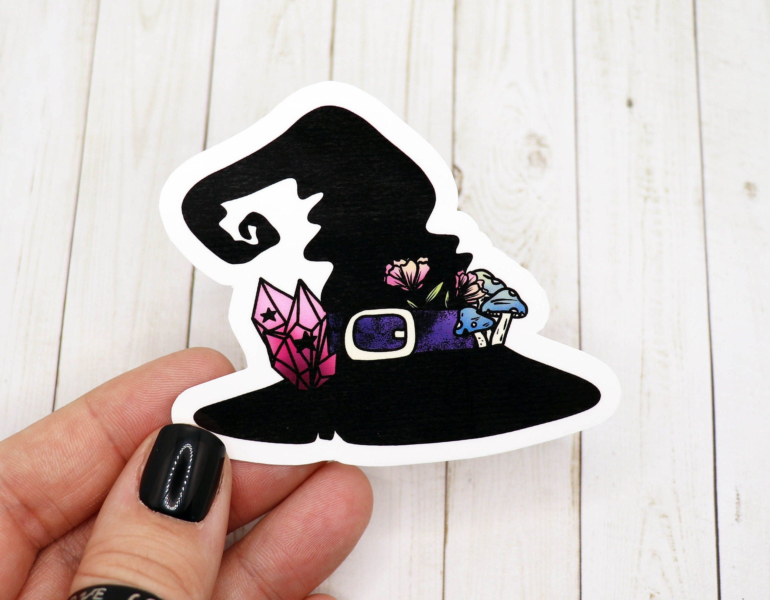 A stylish witch hat sticker made of matte vinyl, featuring a whimsical design perfect for personalizing various items.