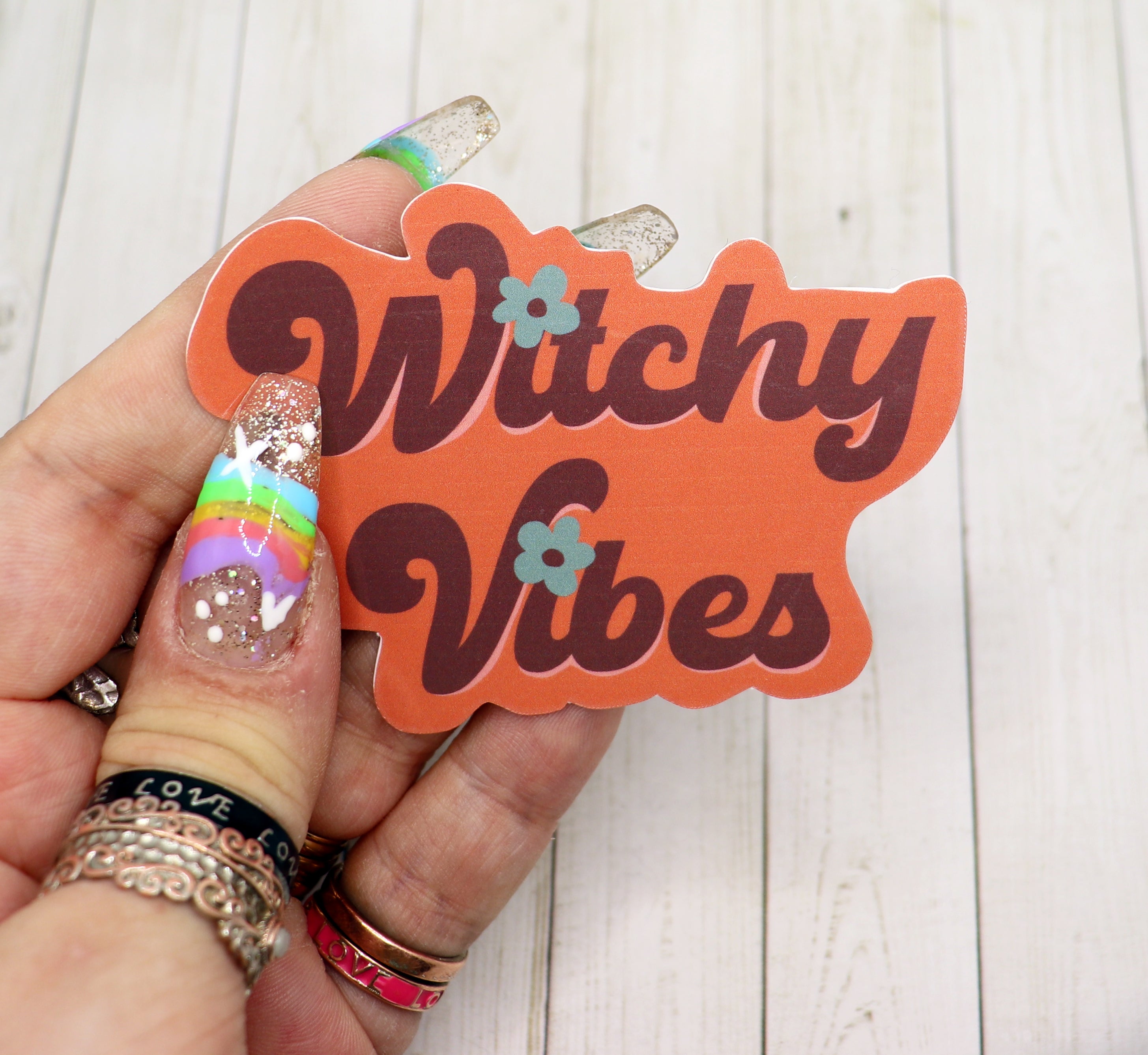 A vibrant Witchy Vibes Vinyl Sticker featuring mystical designs, perfect for personalizing various items.