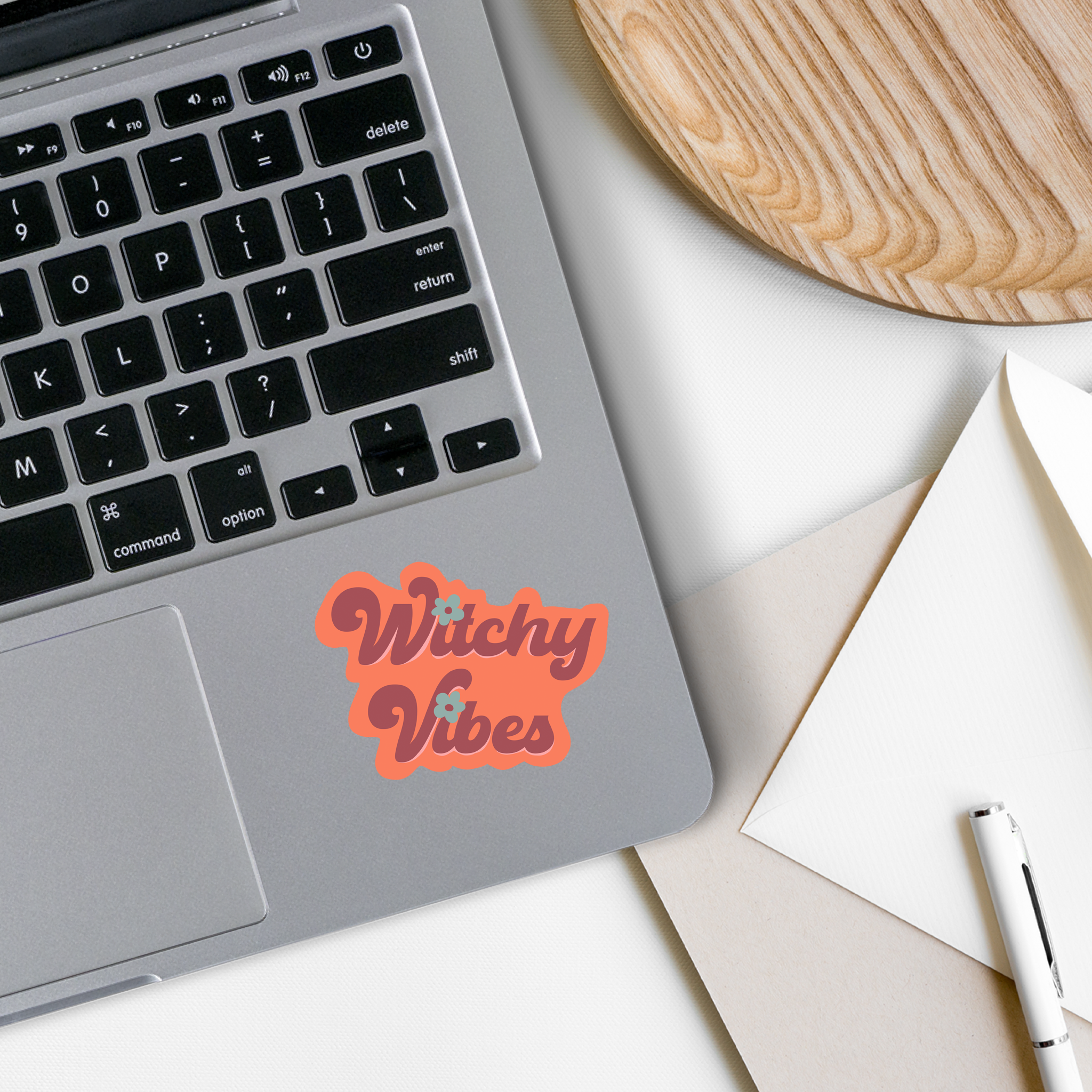 A vibrant Witchy Vibes Vinyl Sticker featuring mystical designs, perfect for personalizing various items.