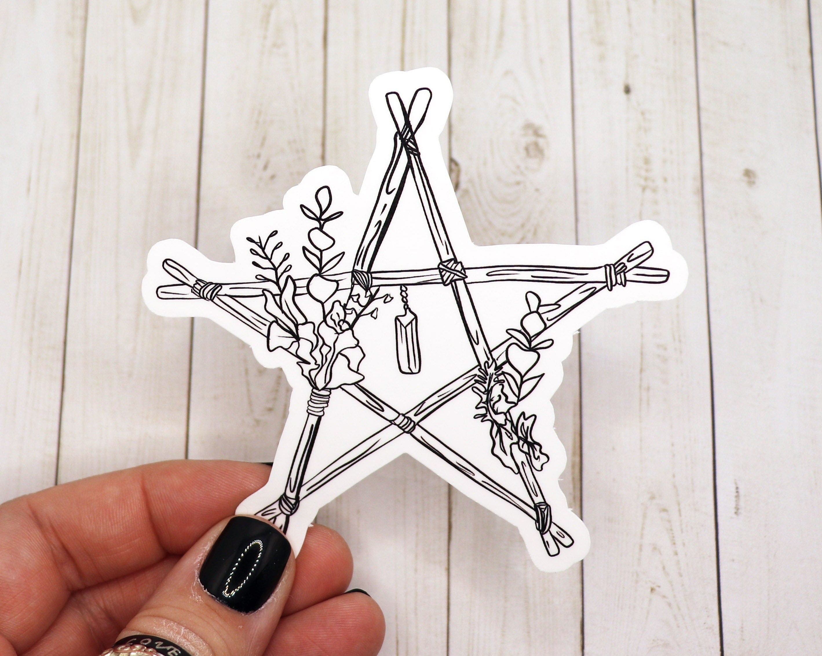 A beautifully designed Wooden Star Witch Sticker featuring intricate details and a whimsical star shape, perfect for personalizing various items.