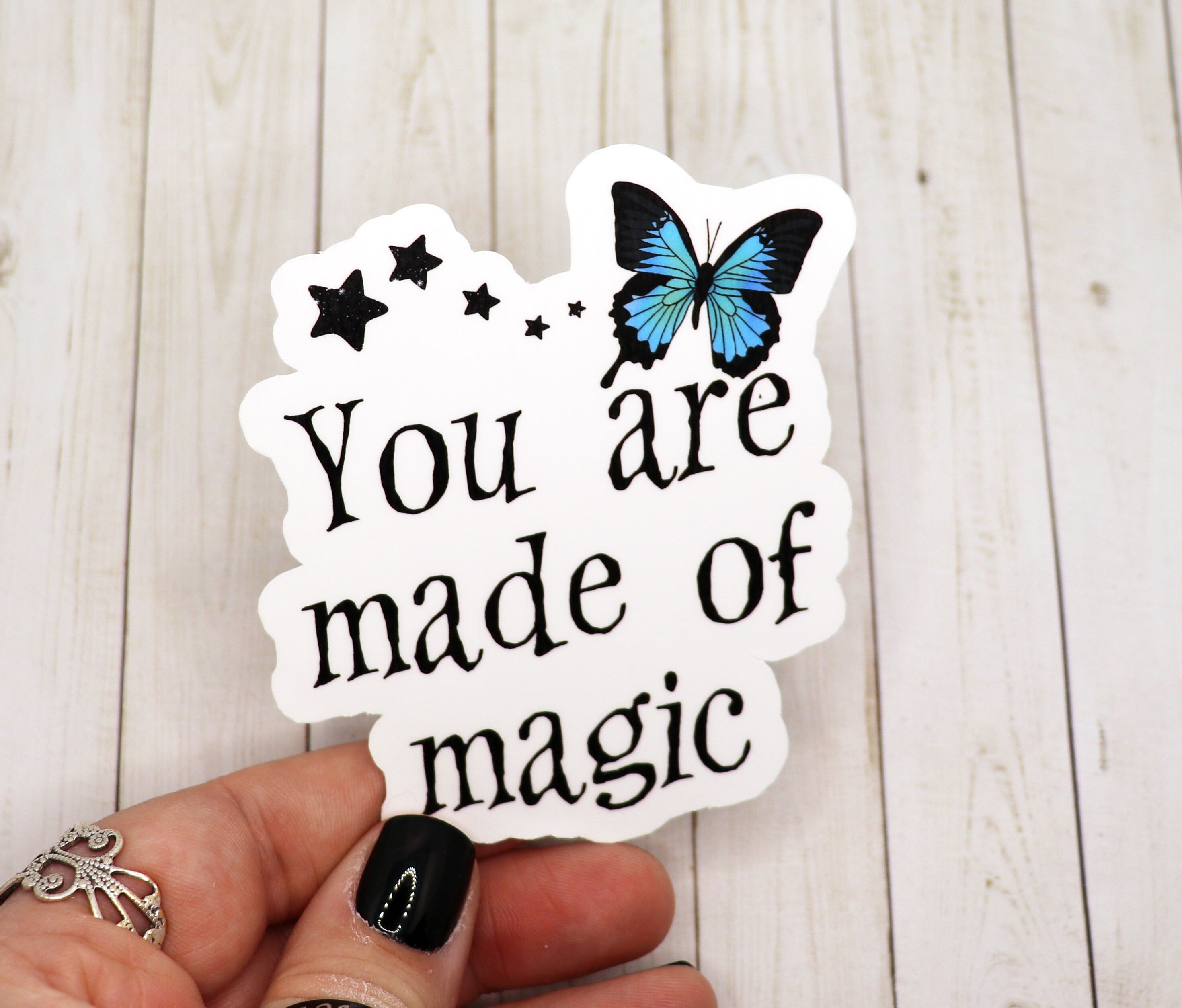 A vibrant 'You Are Made of Magic' sticker on a matte vinyl surface, showcasing its colorful design and high-quality finish.
