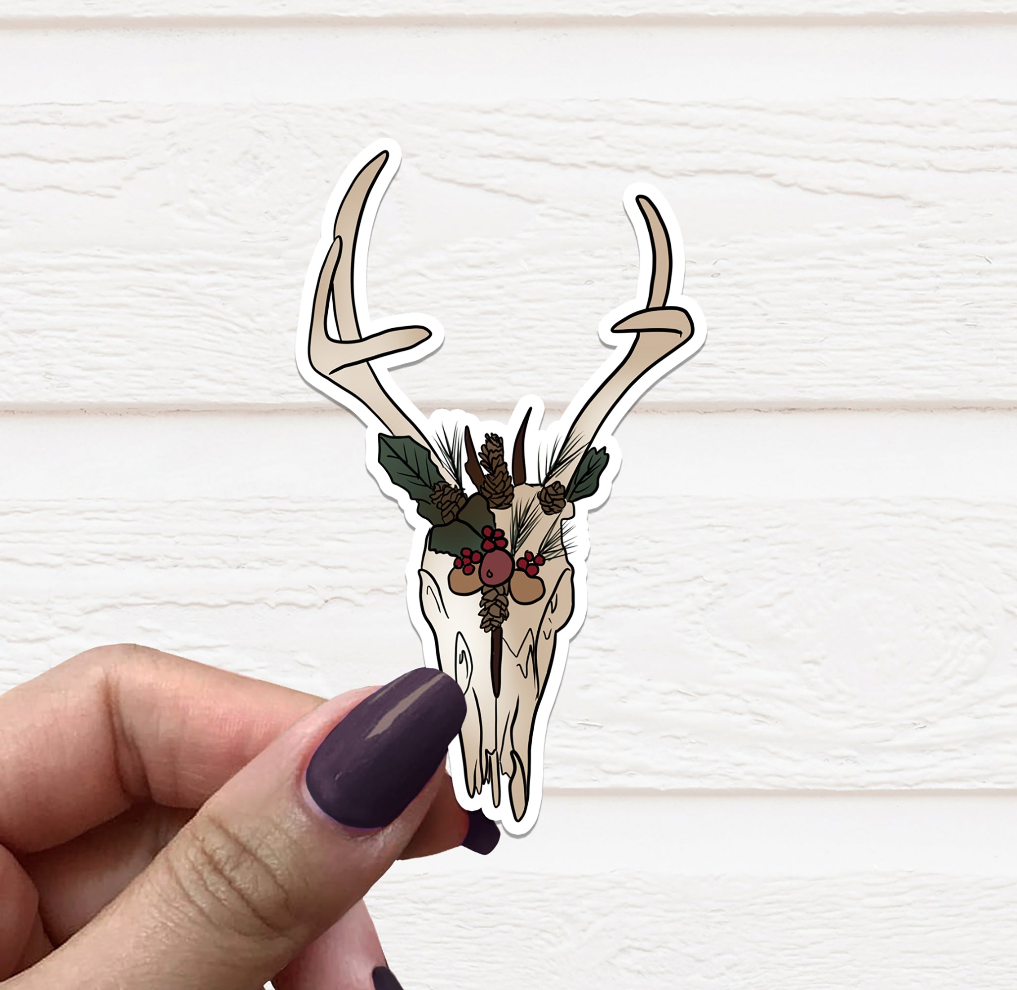Yule Stag Skull vinyl sticker featuring a festive stag skull design on matte vinyl, ideal for personalizing items.