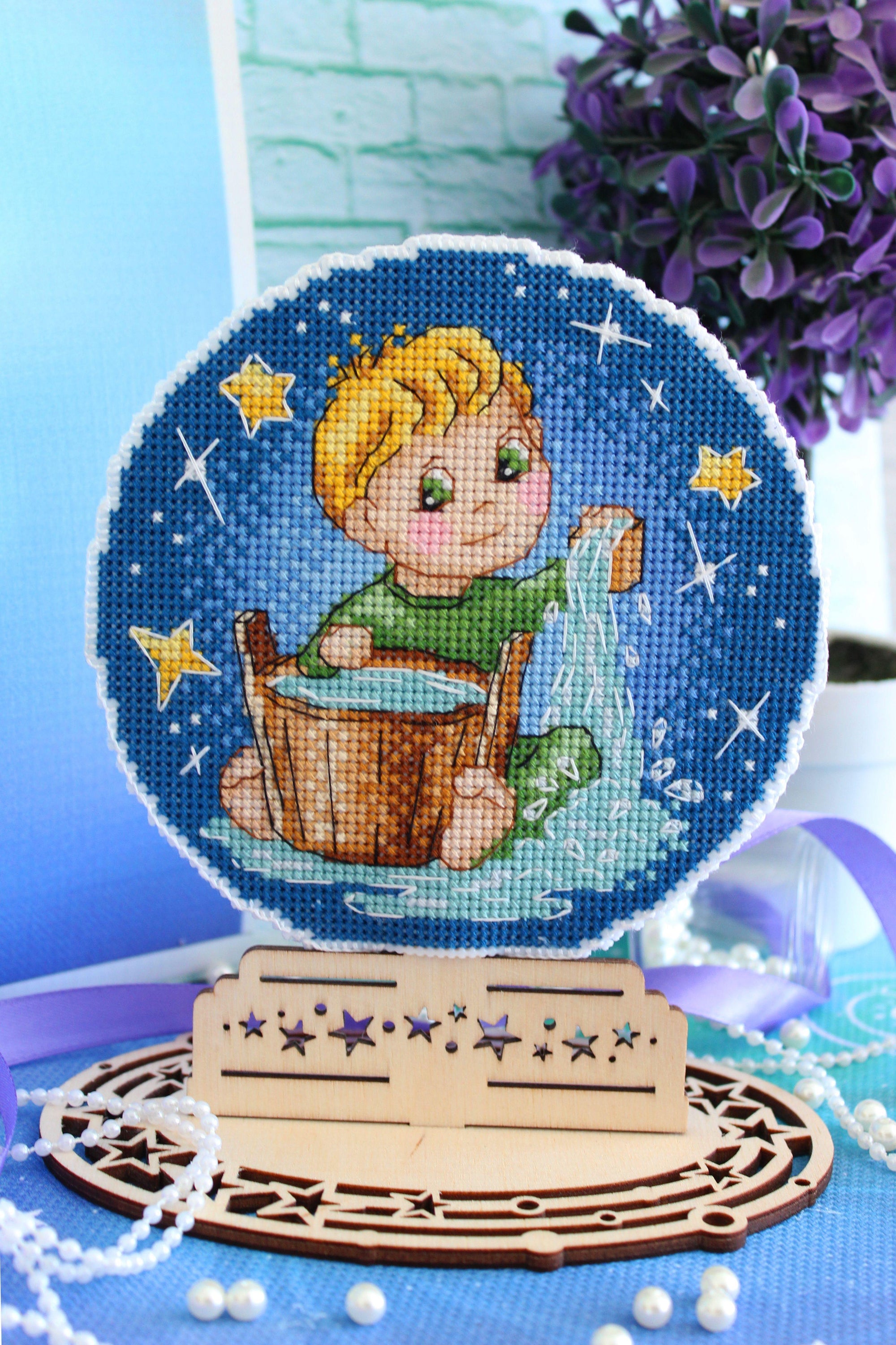 Aquarius SR-700 Plastic Canvas Counted Cross Stitch Kit featuring vibrant threads and plastic canvas for crafting.