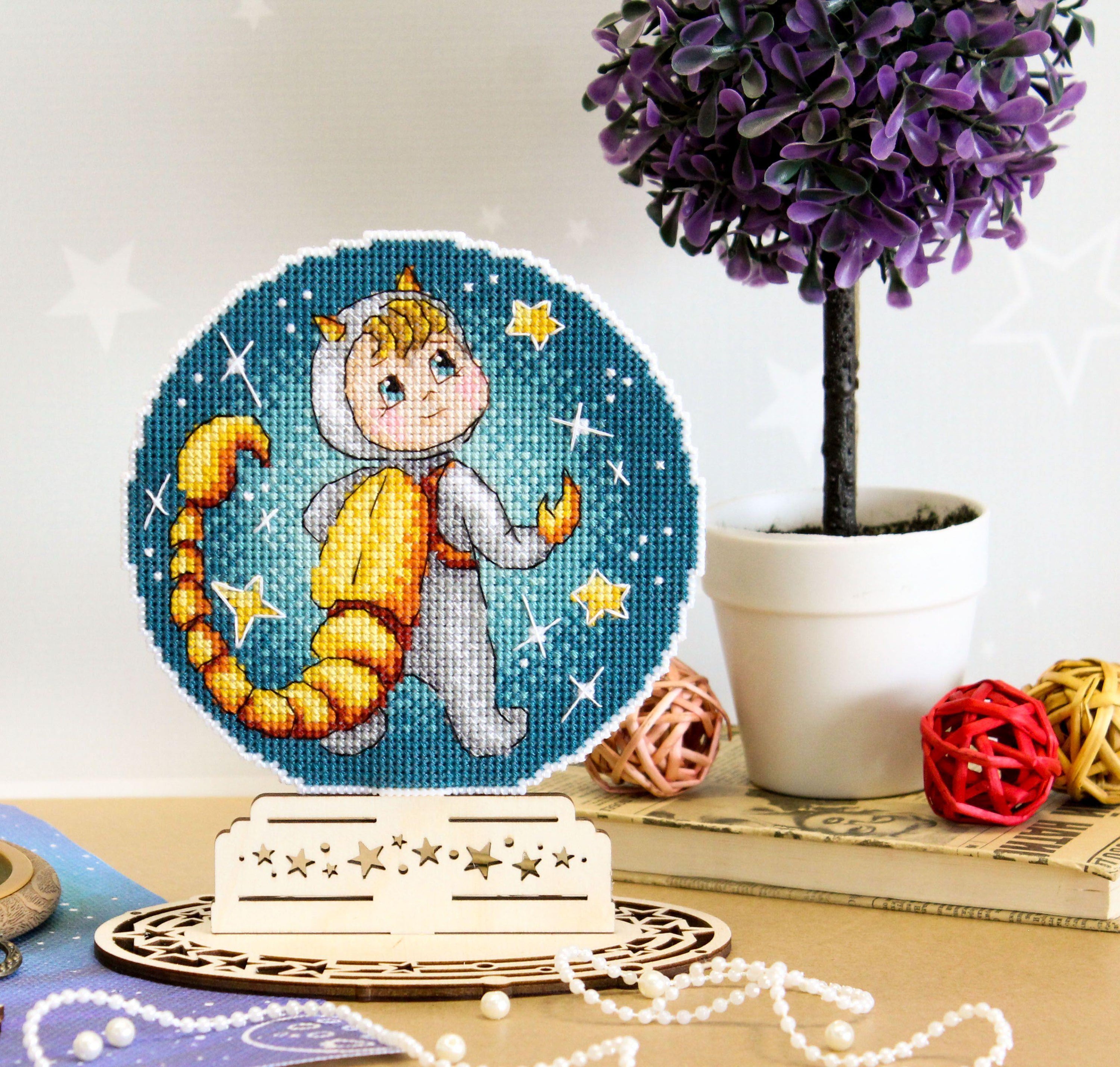 Scorpio SR-701 Plastic Canvas Counted Cross Stitch Kit featuring white canvas, colorful threads, and black and white chart.