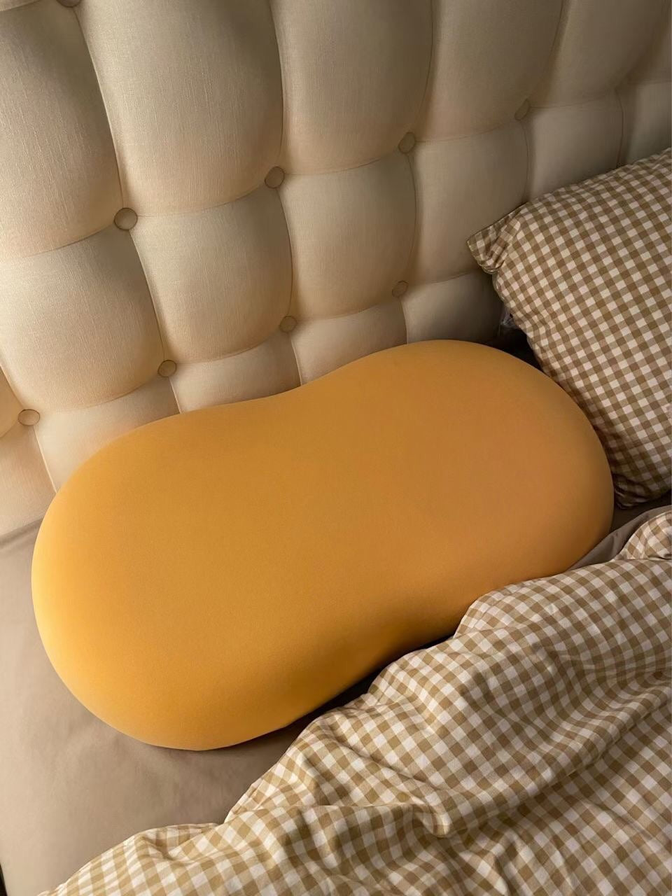 3D Neck Pillow made of memory foam with a soft yellow cotton cover, designed for travel comfort and support.