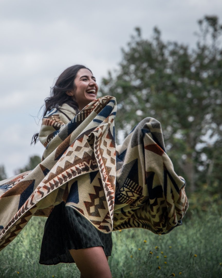 Awa Blanket - Earth, showcasing vibrant colors and intricate patterns, handcrafted by indigenous artisans from Ecuador.