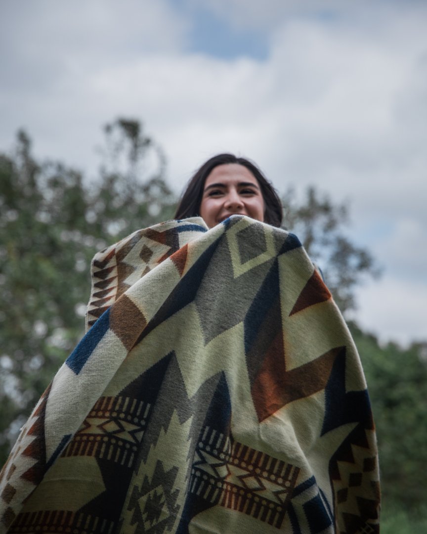 Awa Blanket - Earth, showcasing vibrant colors and intricate patterns, handcrafted by indigenous artisans from Ecuador.