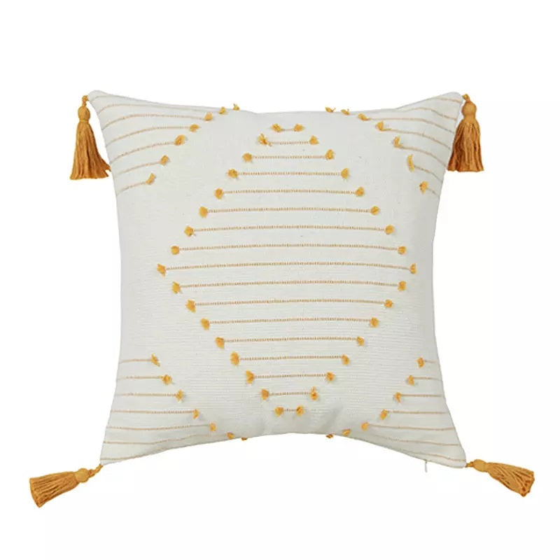 Boho tassel style tufted square cushion covers in a stylish living room setting, showcasing their elegant design and vibrant colors.