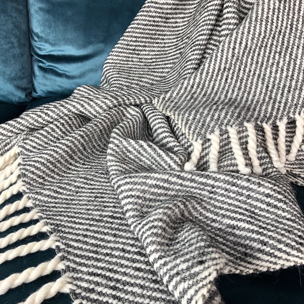 Chunky Black Stripe Alpaca Throw showcasing luxurious texture and classic design, perfect for cozying up on a sofa or bed.