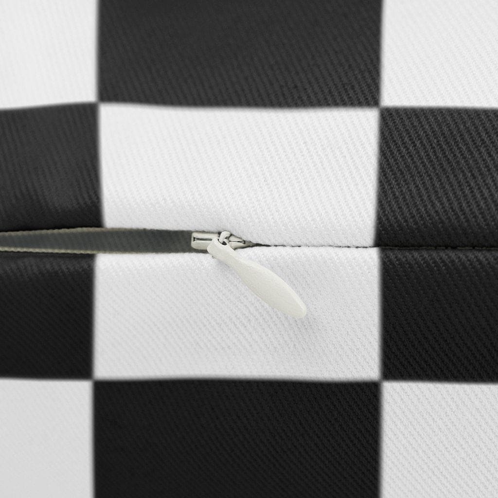 Decorative lumbar throw pillow featuring a black and white checkered pattern, made from spun-polyester with a concealed zipper.