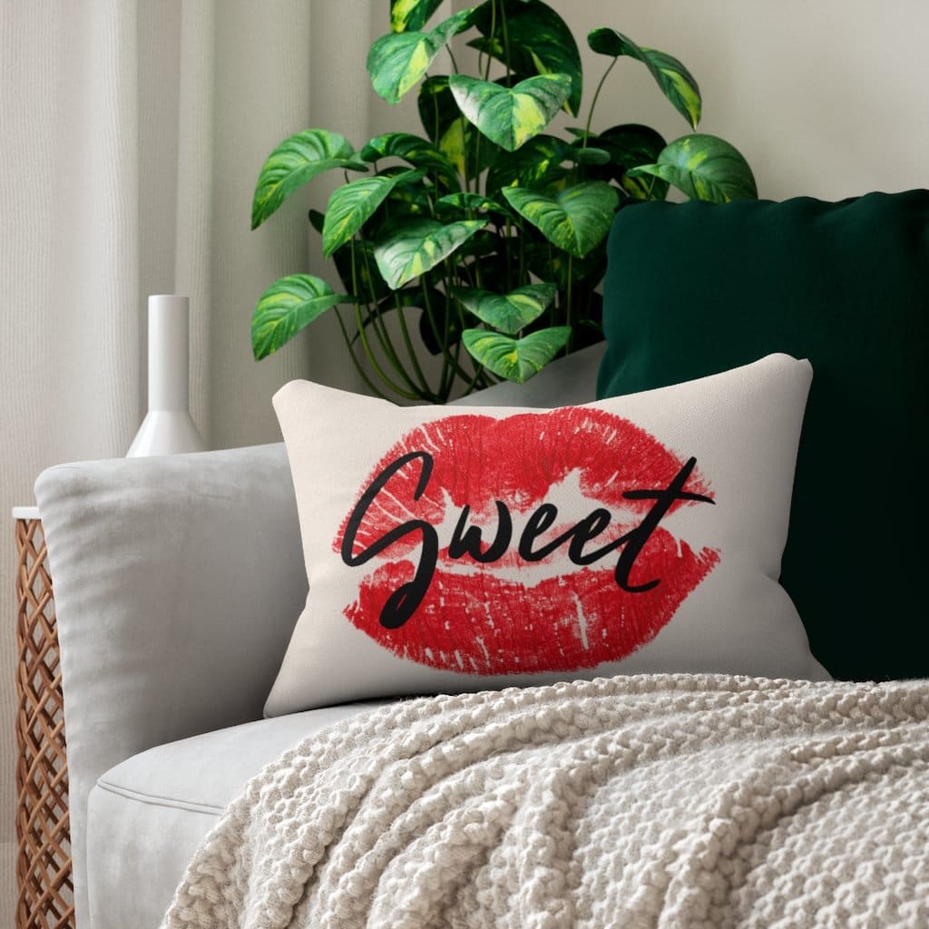Decorative lumbar throw pillow featuring a stylish beige and black design with sweet lips print.