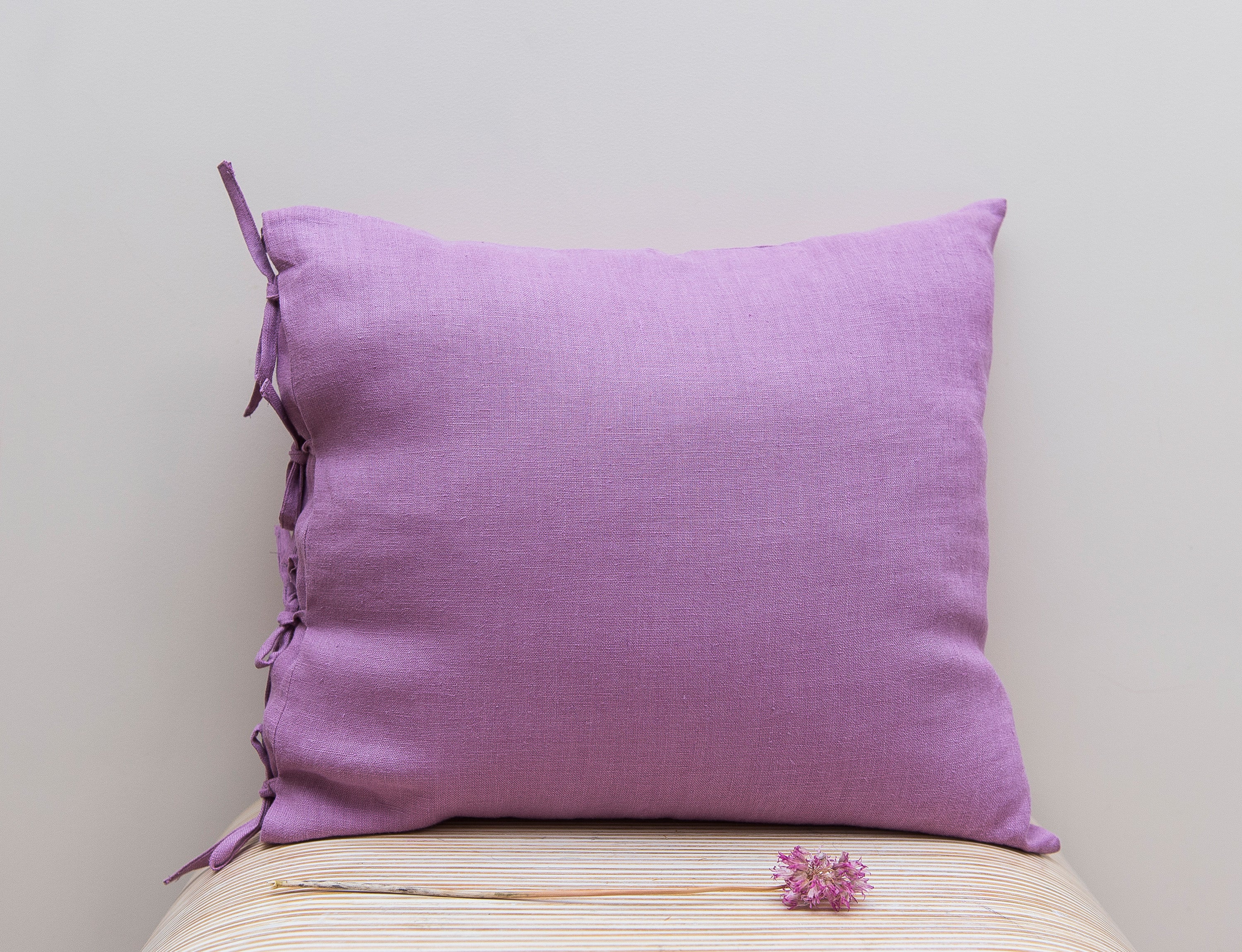 Deep Rose linen pillowcase with elegant tie closure, showcasing soft texture and rich color.