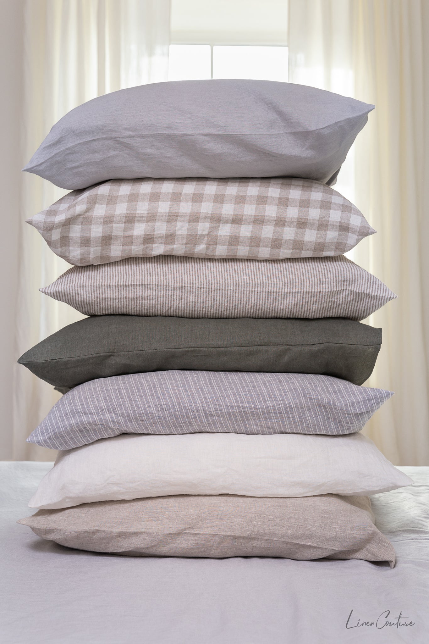 Deep Rose linen pillowcase with elegant tie closure, showcasing soft texture and rich color.