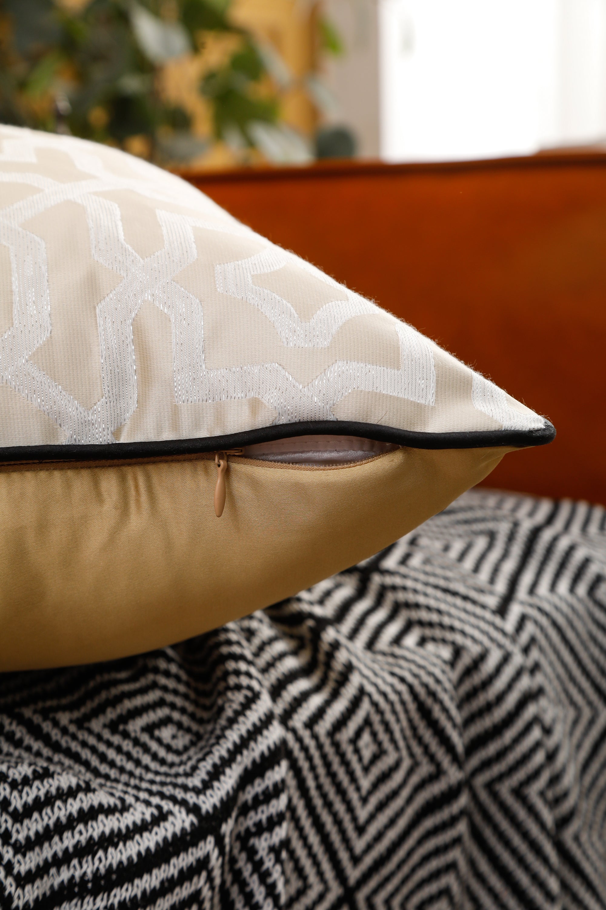 Designer cushion cover with black piping, 18x18 inches, showcasing elegant design suitable for various room settings.