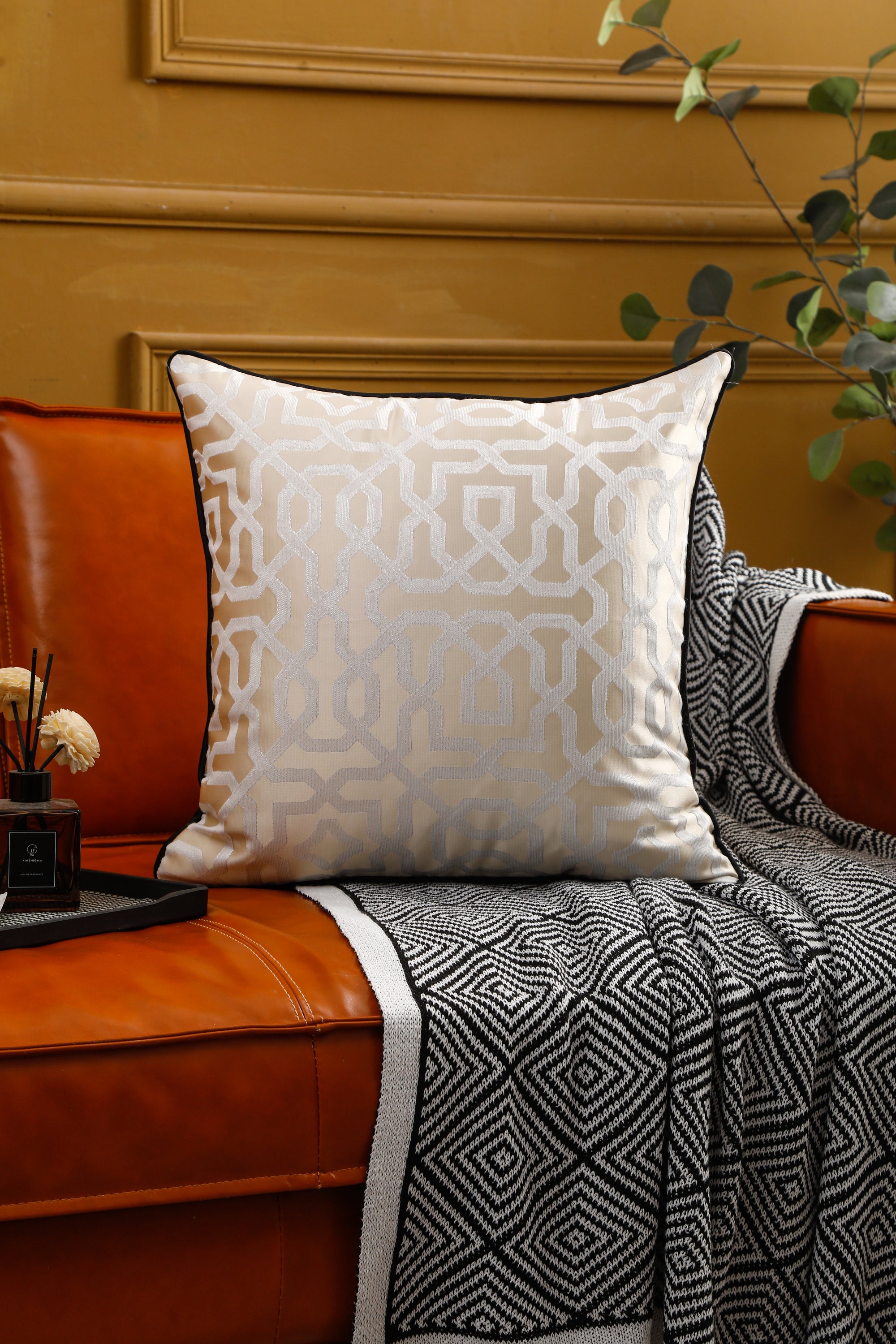 Designer cushion cover with black piping, 18x18 inches, showcasing elegant design suitable for various room settings.