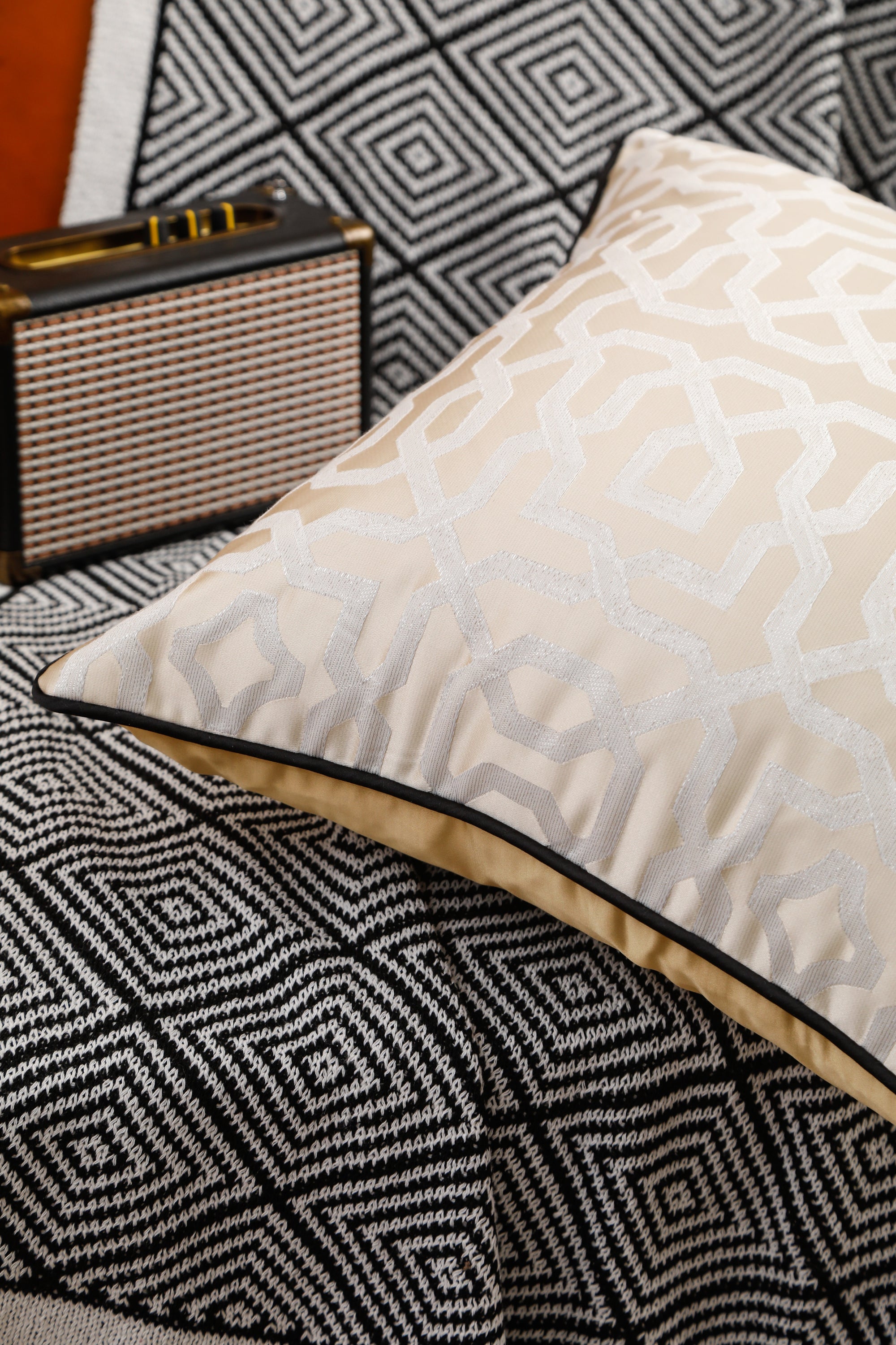 Designer cushion cover with black piping, 18x18 inches, showcasing elegant design suitable for various room settings.