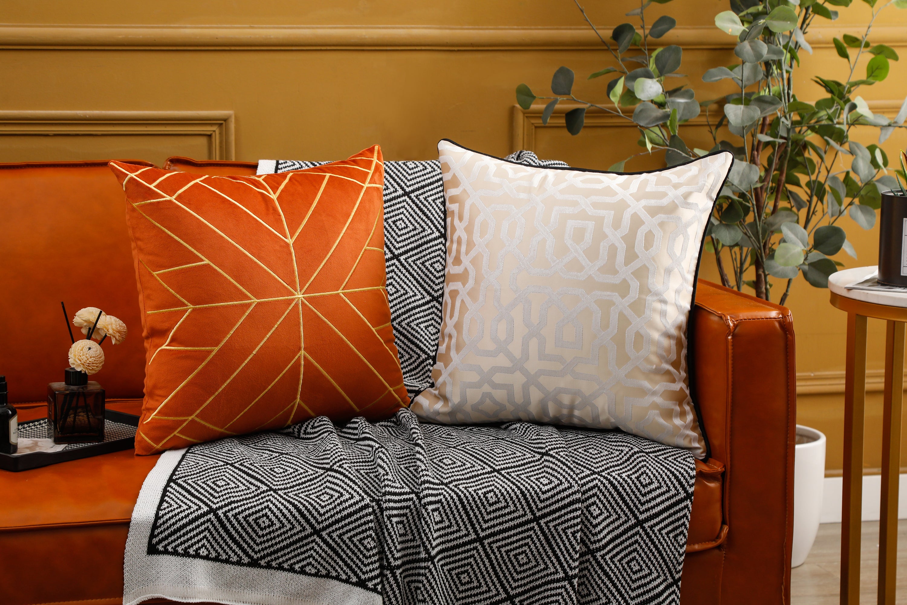 Designer cushion cover with black piping, 18x18 inches, showcasing elegant design suitable for various room settings.