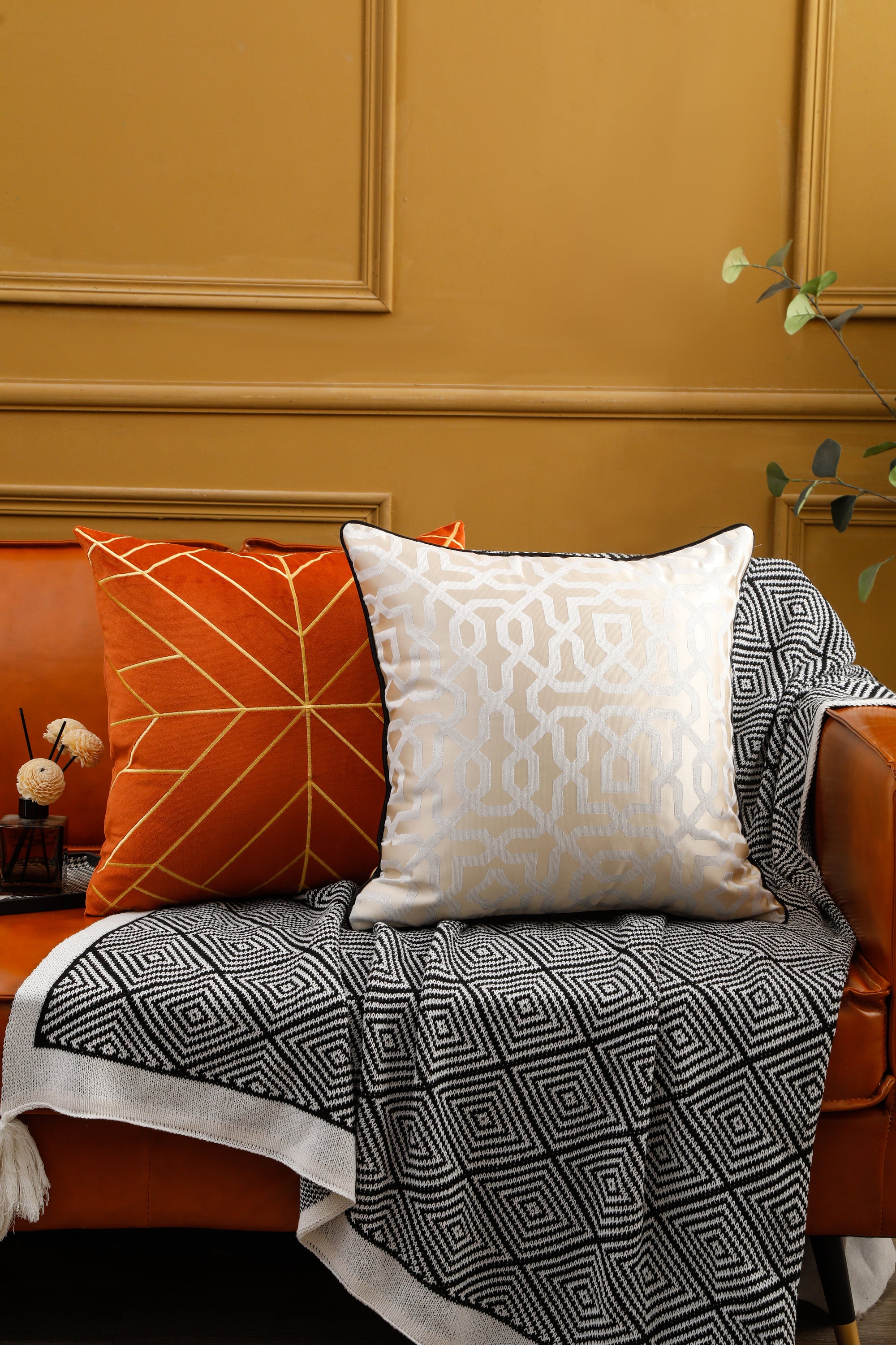 Designer cushion cover with black piping, 18x18 inches, showcasing elegant design suitable for various room settings.